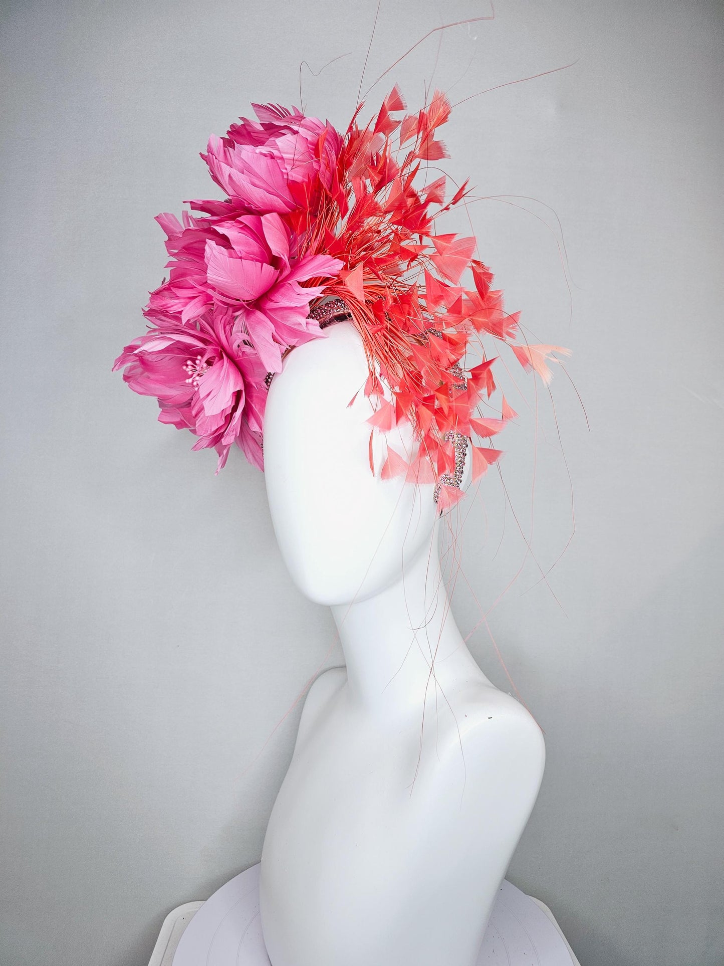 kentucky derby hat fascinator with rose pink feather flowers, light orange coral branching feathers, light pink crystal rhinestone headband