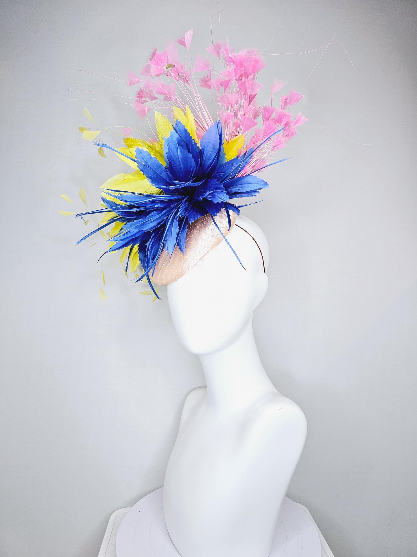 kentucky derby hat fascinator champagne satin with netting,cobalt royal blue and yellow feather flower, light blush pink branching feathers