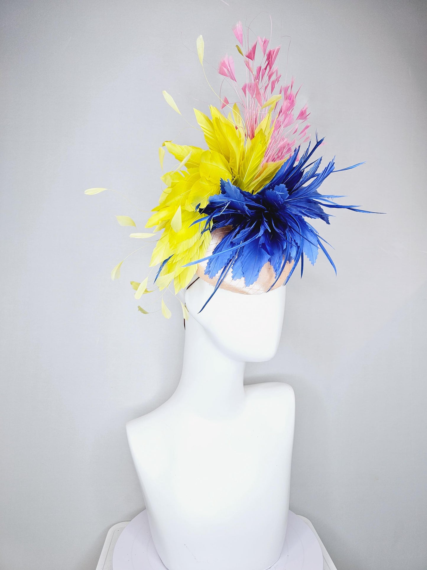 kentucky derby hat fascinator champagne satin with netting,cobalt royal blue and yellow feather flower, light blush pink branching feathers