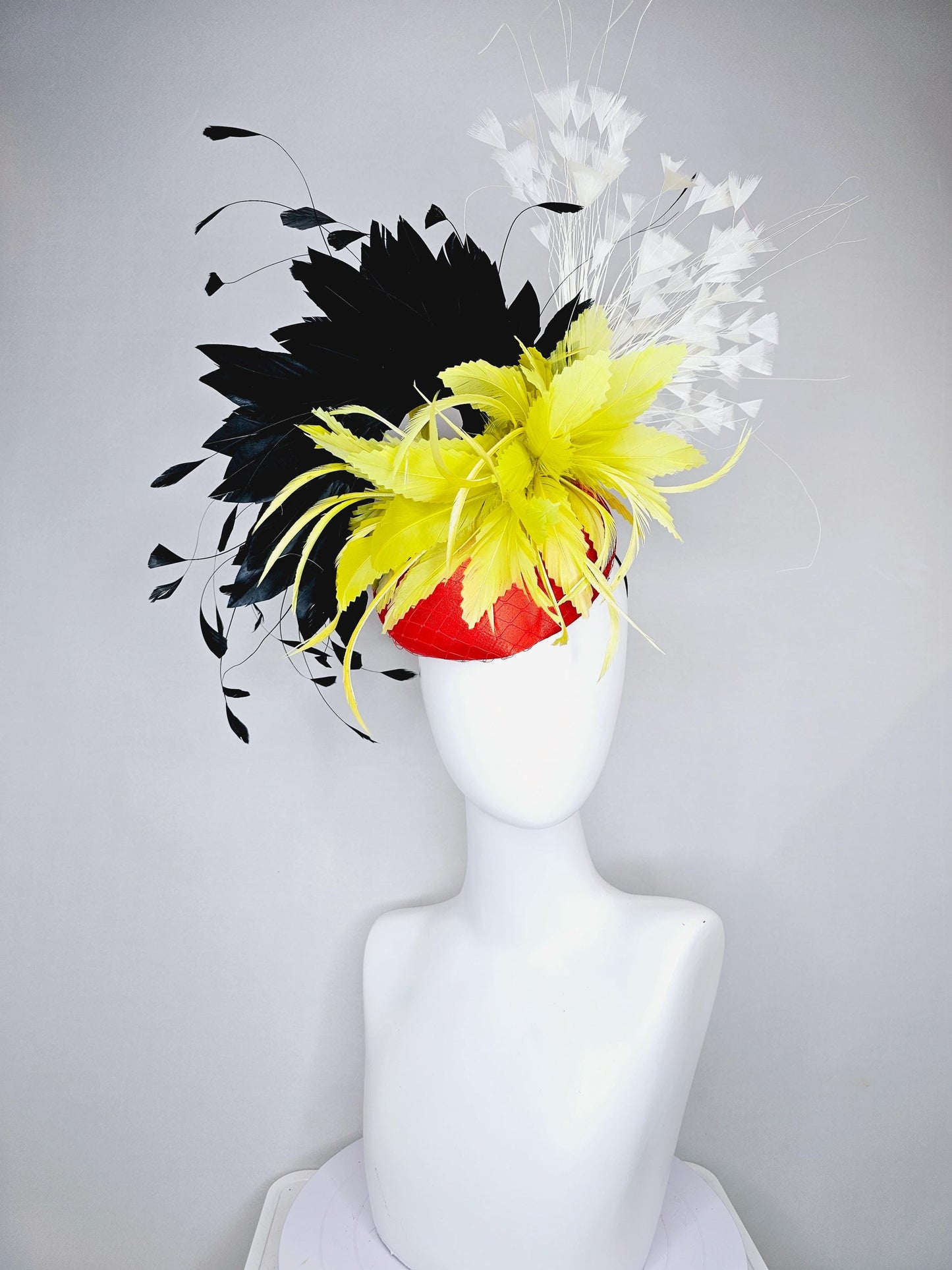 kentucky derby hat fascinator red satin with netting, yellow and black feather flower, white ivory branching feathers