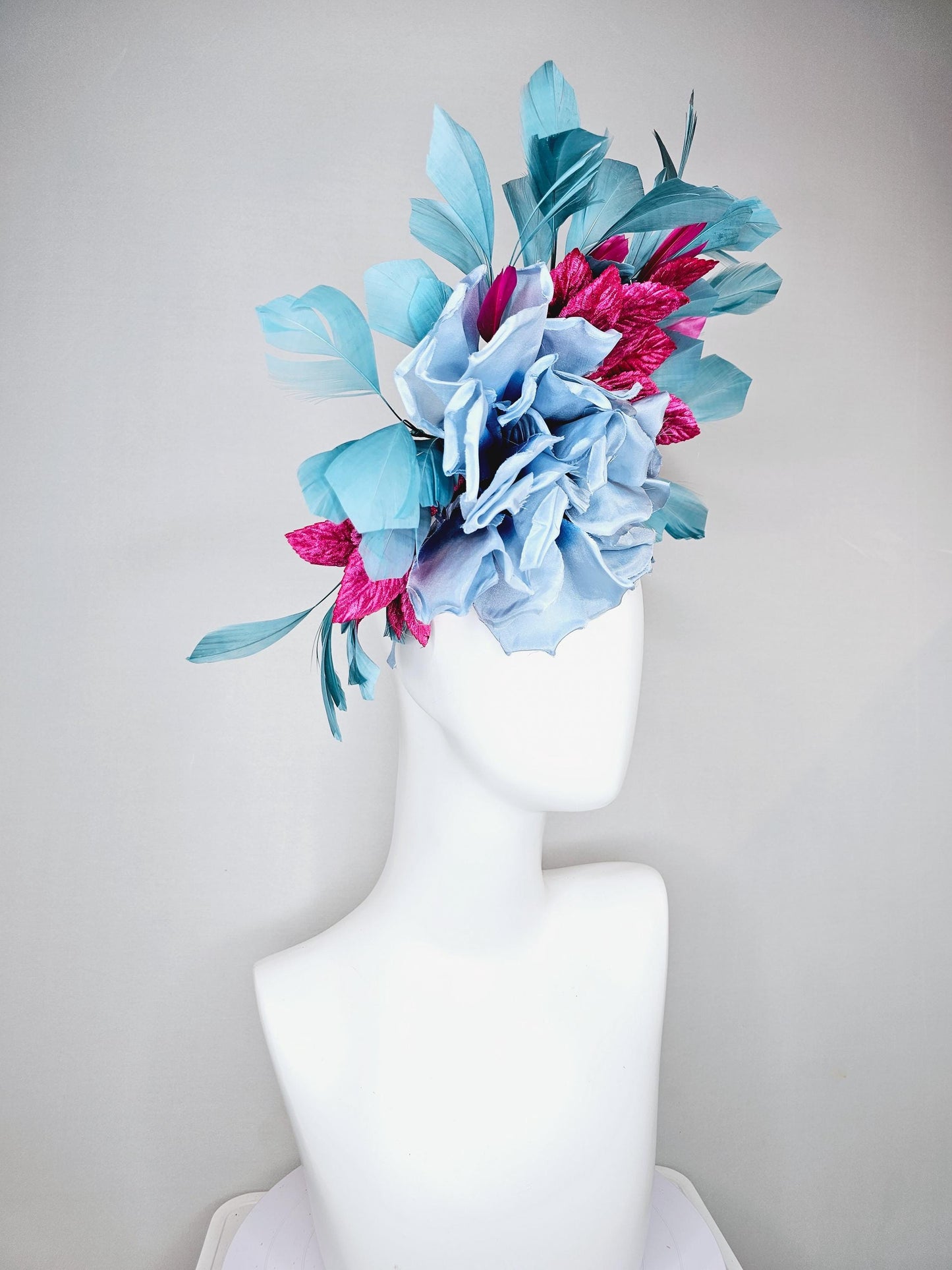 kentucky derby hat fascinator baby blue satin silk flower with fuchsia pink satin leaves and teal blue branching feathers, thin headband