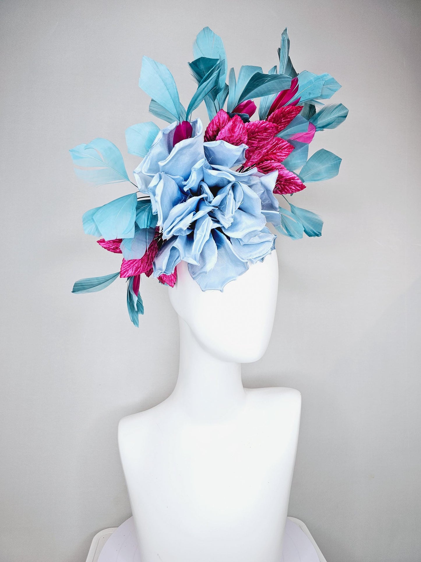 kentucky derby hat fascinator baby blue satin silk flower with fuchsia pink satin leaves and teal blue branching feathers, thin headband