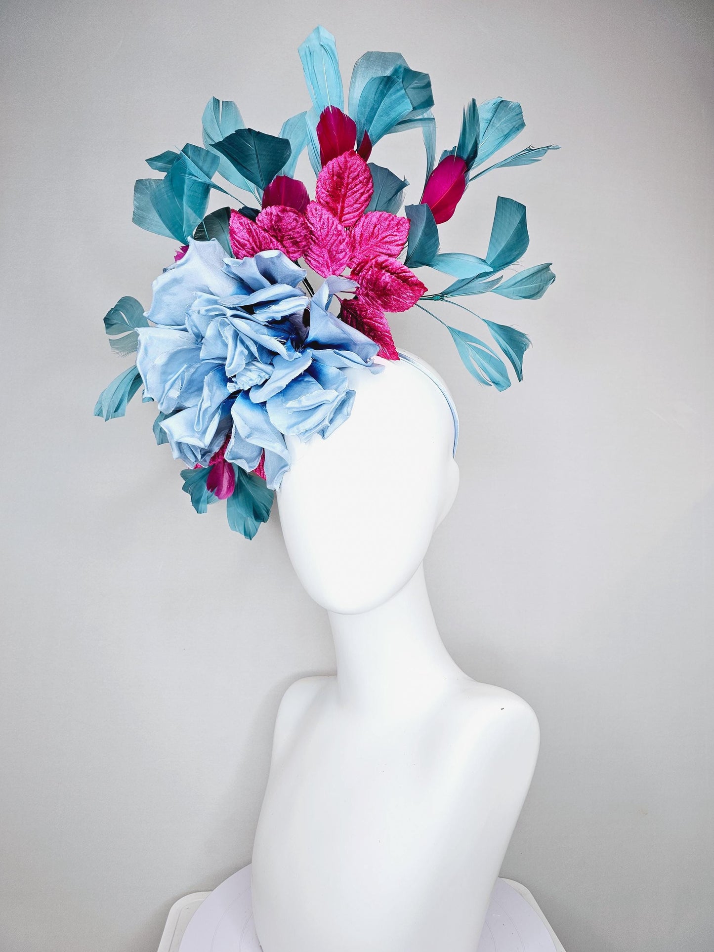 kentucky derby hat fascinator baby blue satin silk flower with fuchsia pink satin leaves and teal blue branching feathers, thin headband