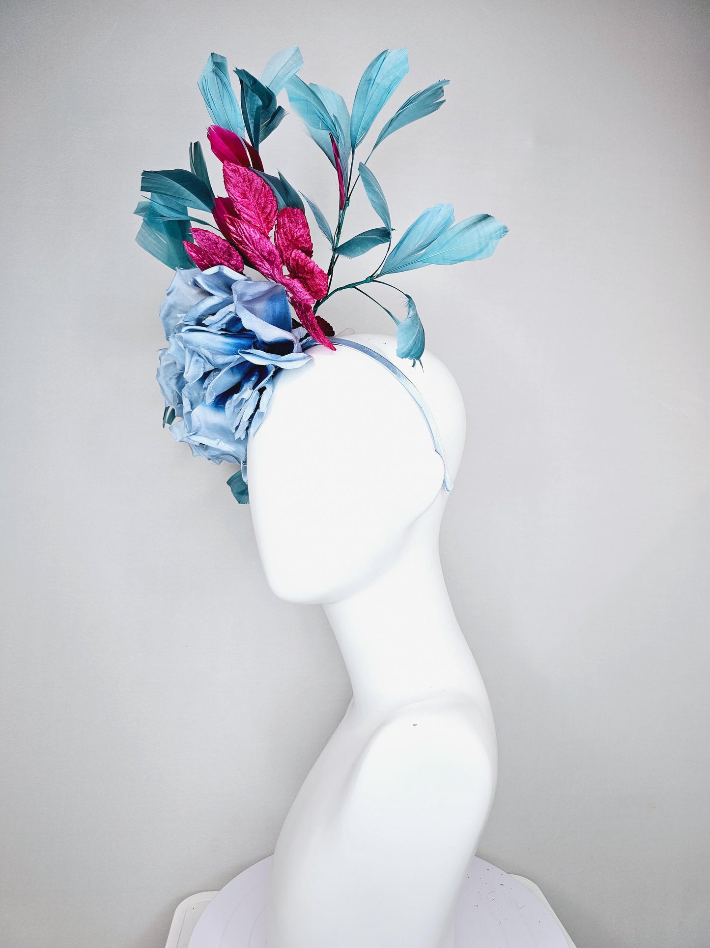 kentucky derby hat fascinator baby blue satin silk flower with fuchsia pink satin leaves and teal blue branching feathers, thin headband