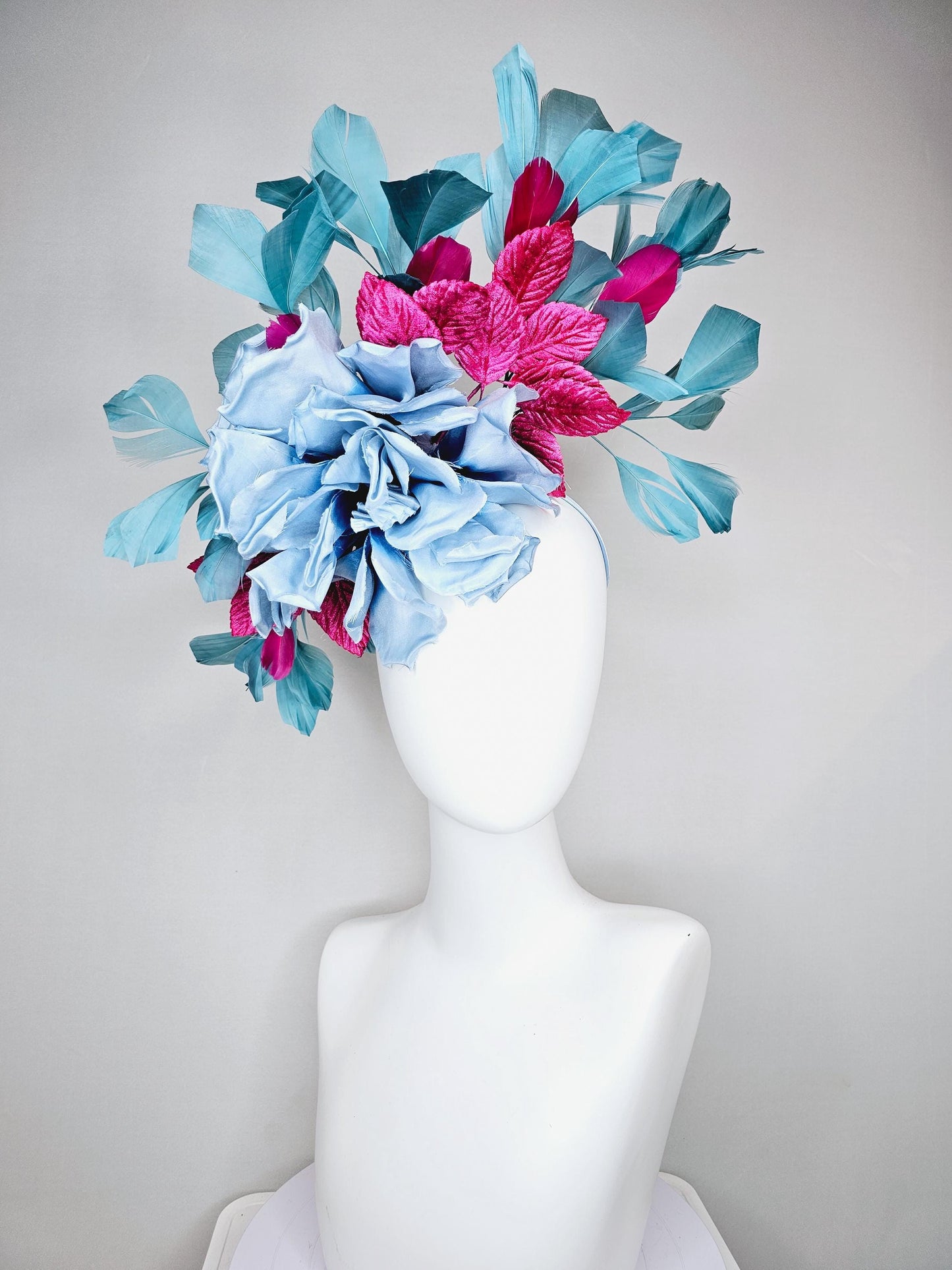kentucky derby hat fascinator baby blue satin silk flower with fuchsia pink satin leaves and teal blue branching feathers, thin headband