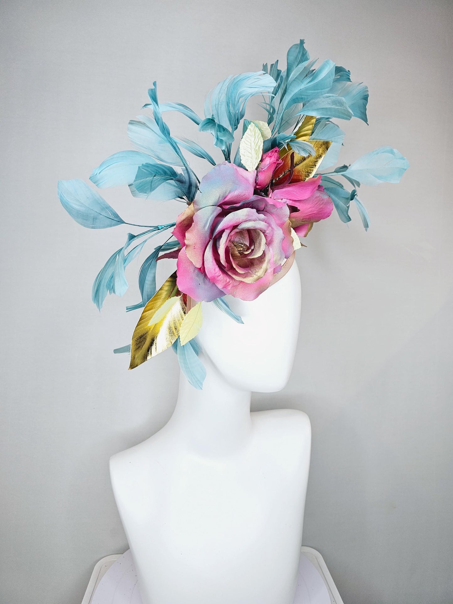 kentucky derby hat fascinator champagne satin with rainbow pink gold teal blue rose flowers and gold leaves, teal blue feathers