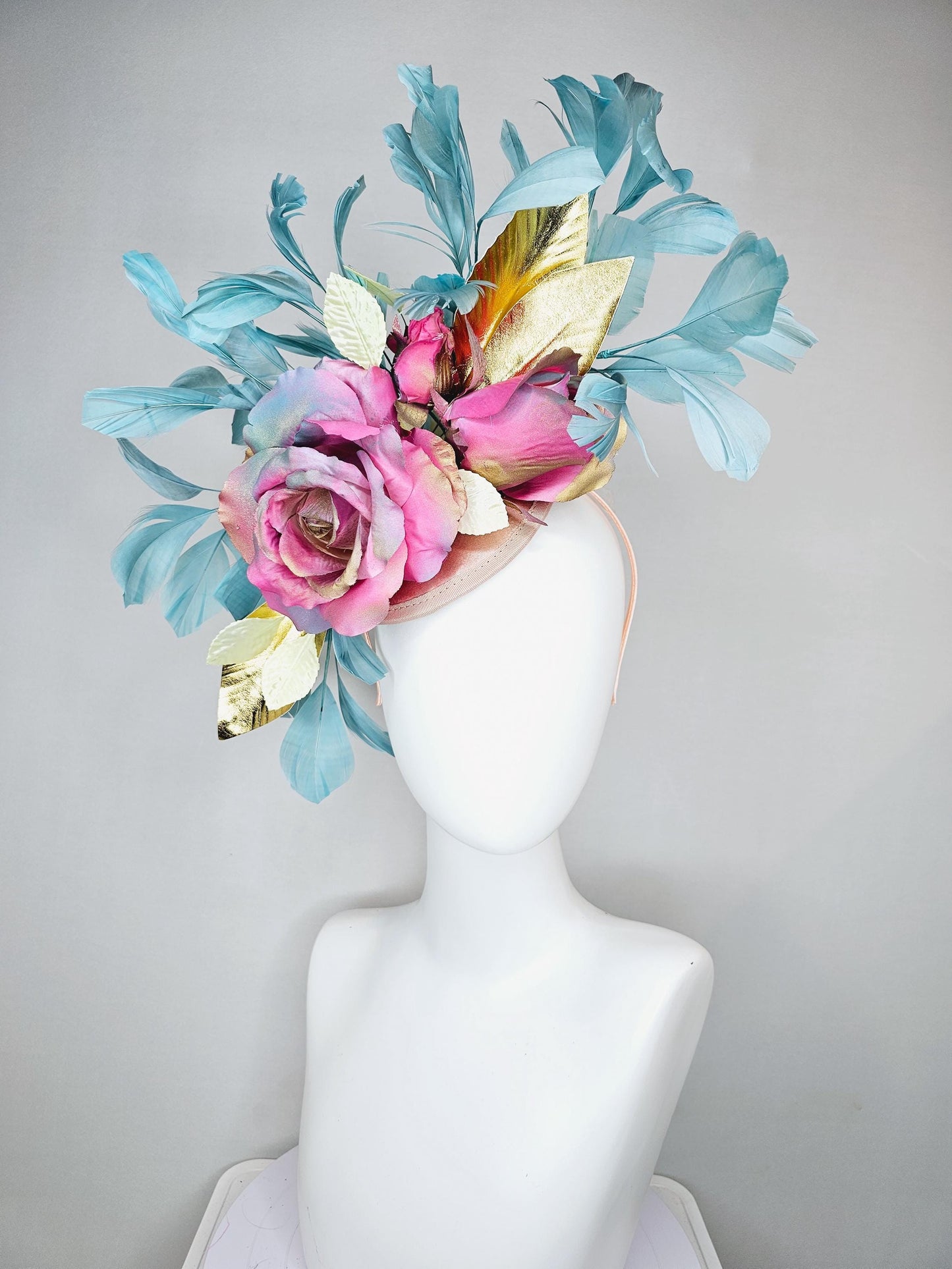 kentucky derby hat fascinator champagne satin with rainbow pink gold teal blue rose flowers and gold leaves, teal blue feathers
