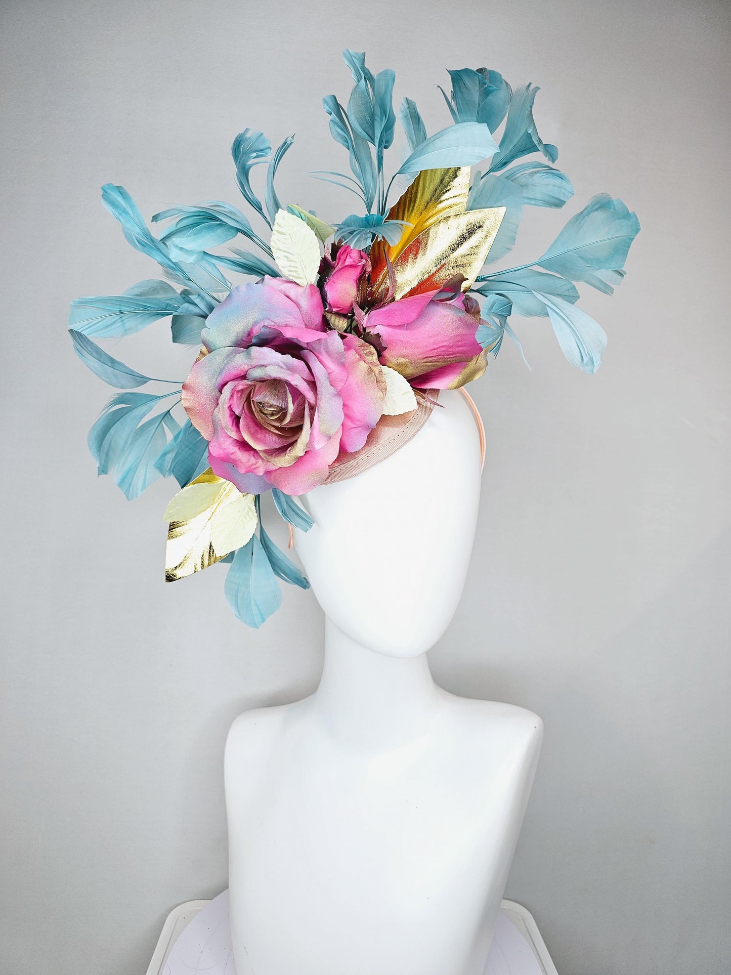 kentucky derby hat fascinator champagne satin with rainbow pink gold teal blue rose flowers and gold leaves, teal blue feathers