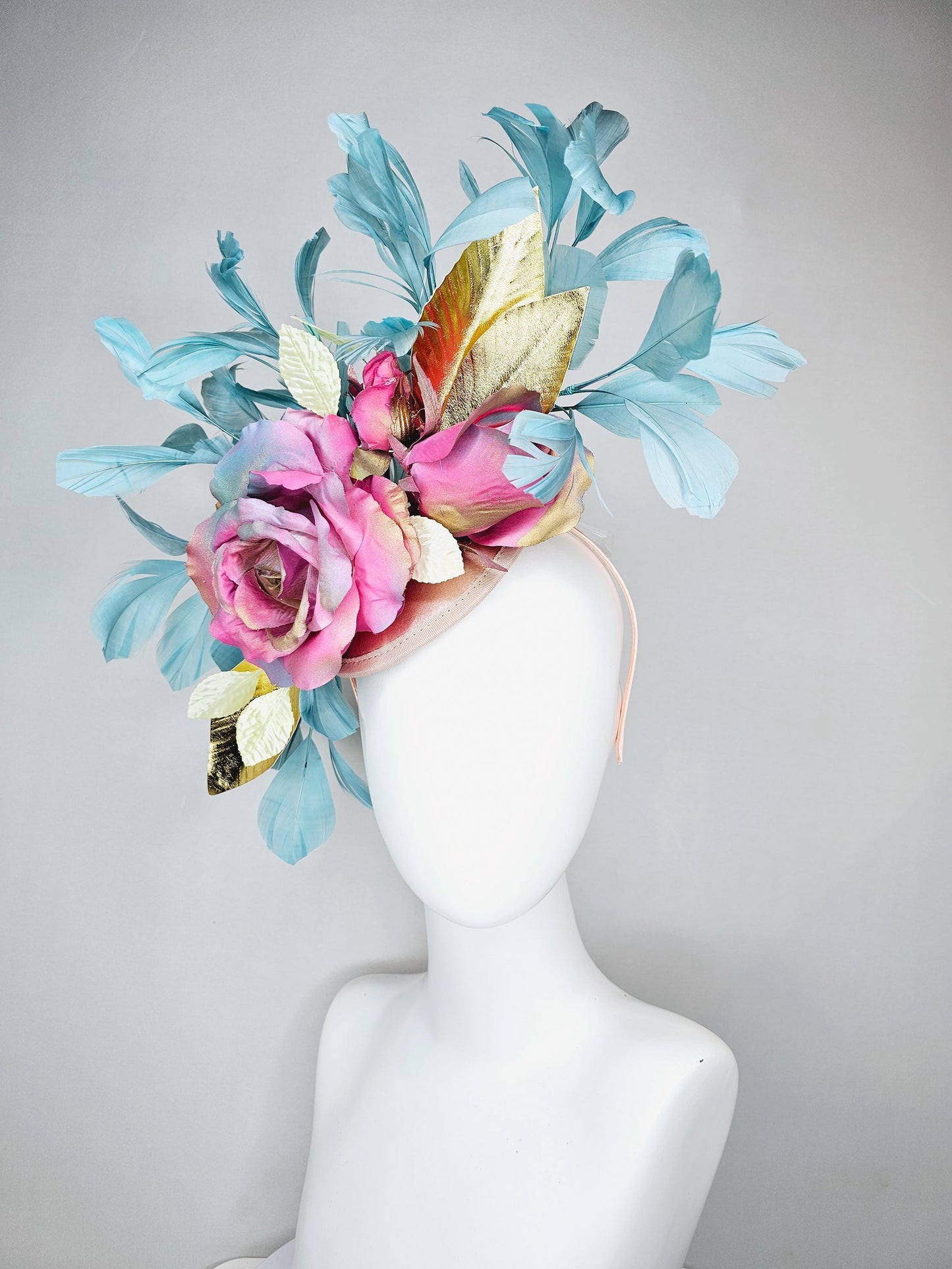 kentucky derby hat fascinator champagne satin with rainbow pink gold teal blue rose flowers and gold leaves, teal blue feathers