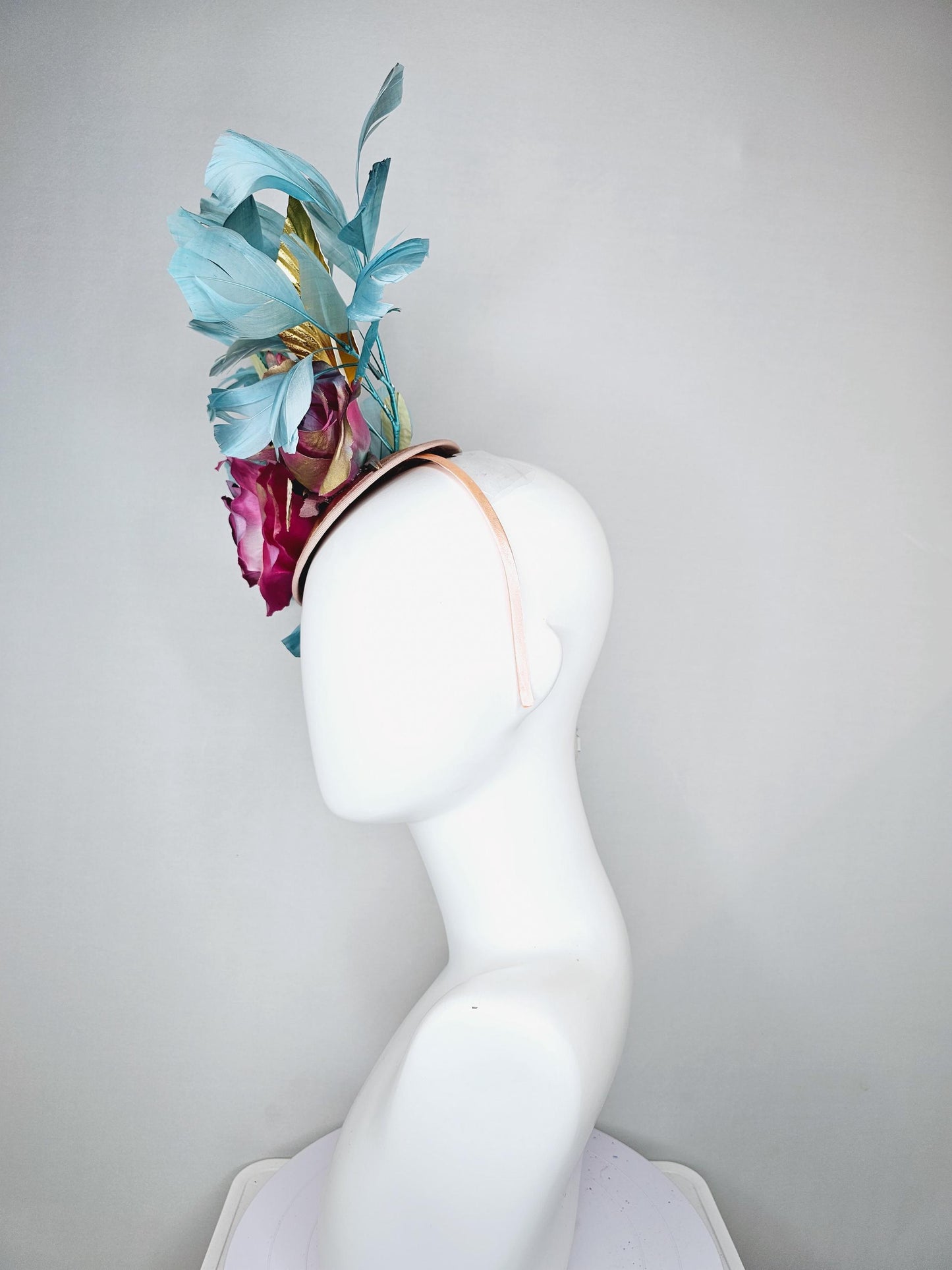kentucky derby hat fascinator champagne satin with rainbow pink gold teal blue rose flowers and gold leaves, teal blue feathers