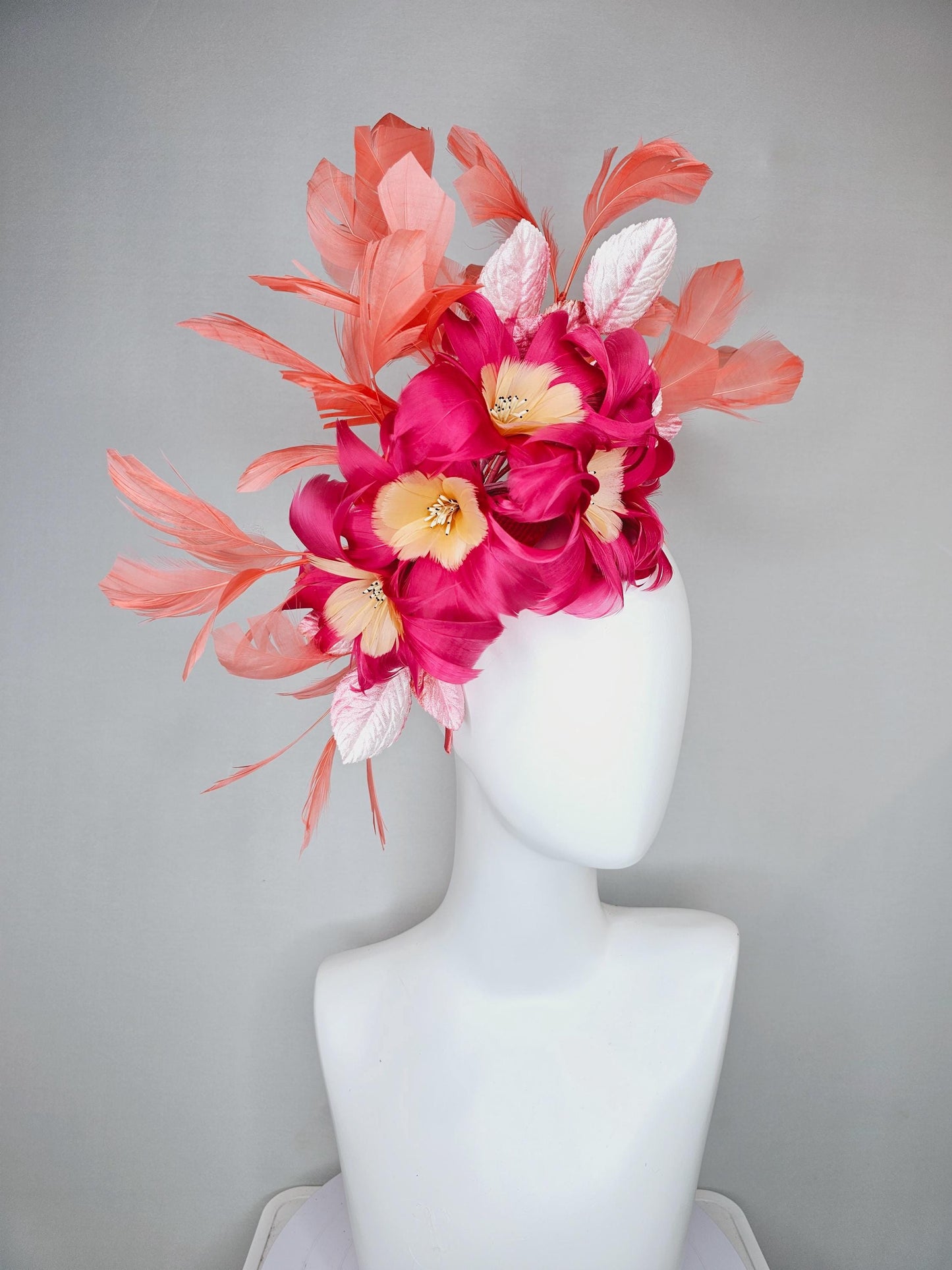 kentucky derby hat fascinator pink feather flowers with light blush pink leaves and coral orange feathers, thin headband