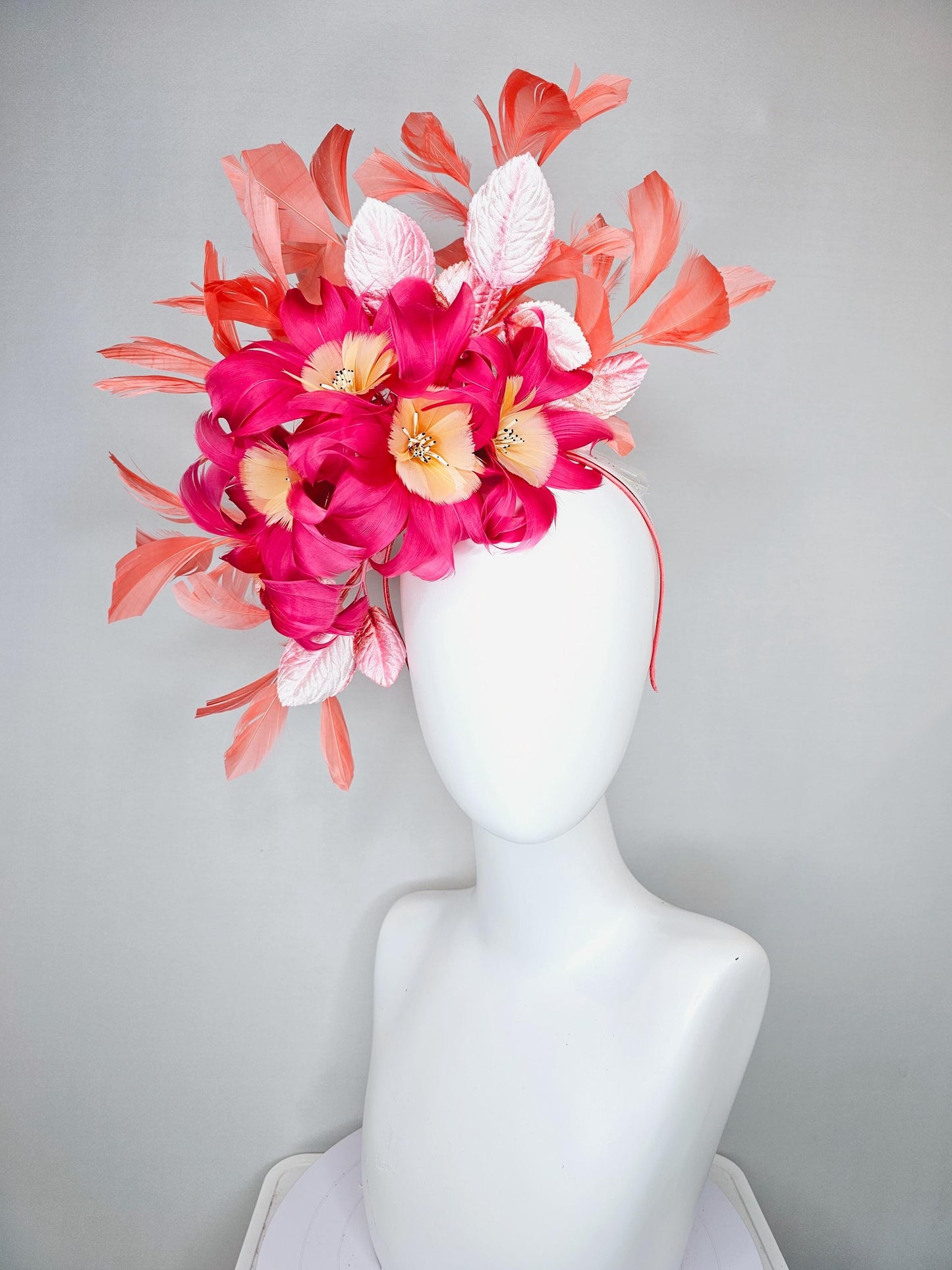 kentucky derby hat fascinator pink feather flowers with light blush pink leaves and coral orange feathers, thin headband