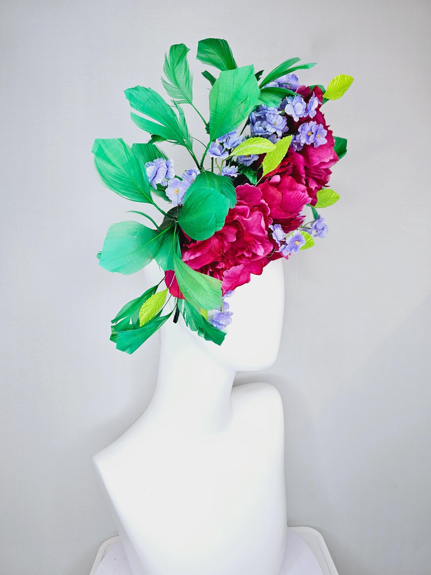 kentucky derby hat fascinator pink sinamay with pink fuchsia satin silk flowers, small light purple flowers,lime green leaves,green feathers