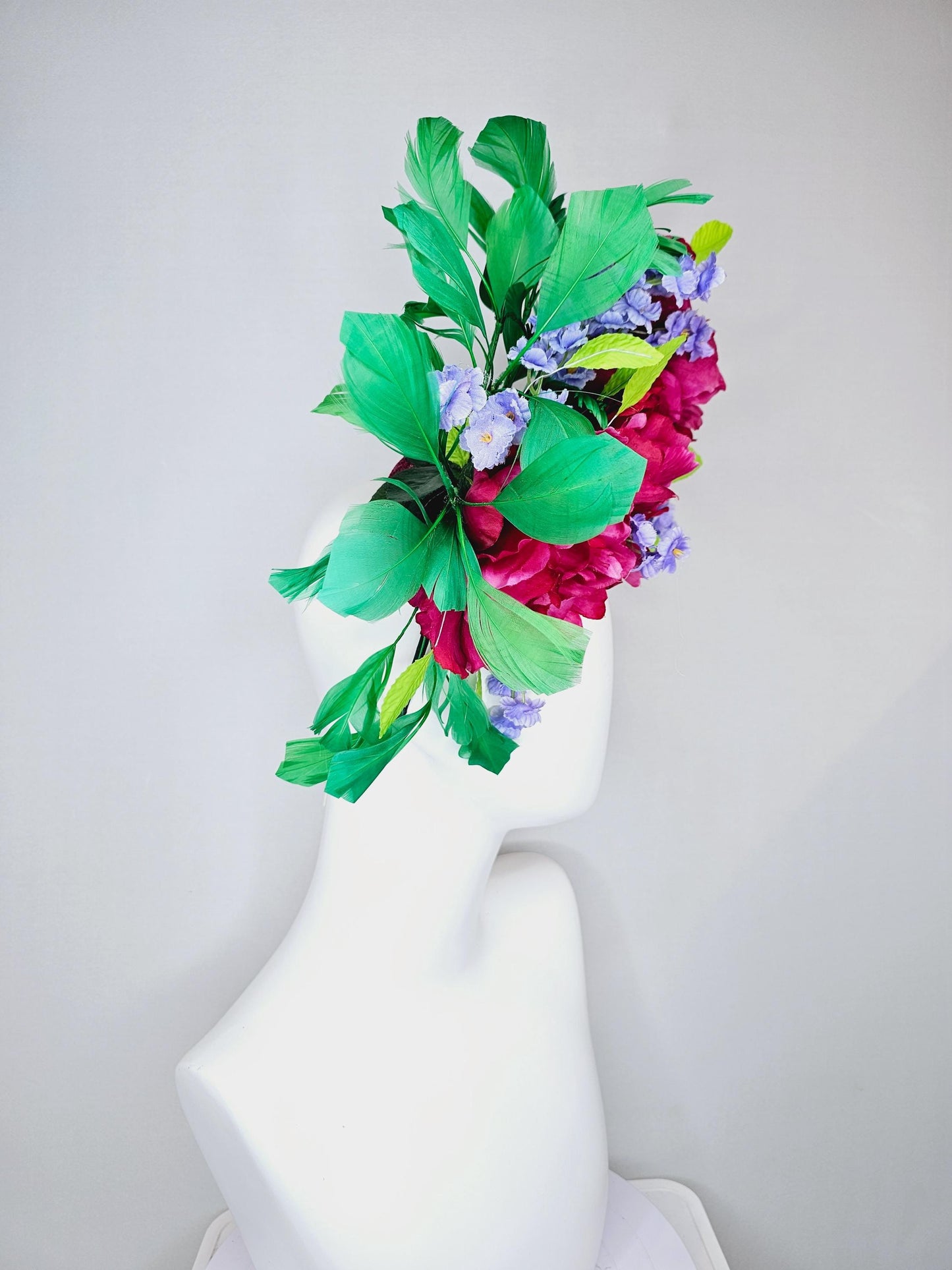 kentucky derby hat fascinator pink sinamay with pink fuchsia satin silk flowers, small light purple flowers,lime green leaves,green feathers