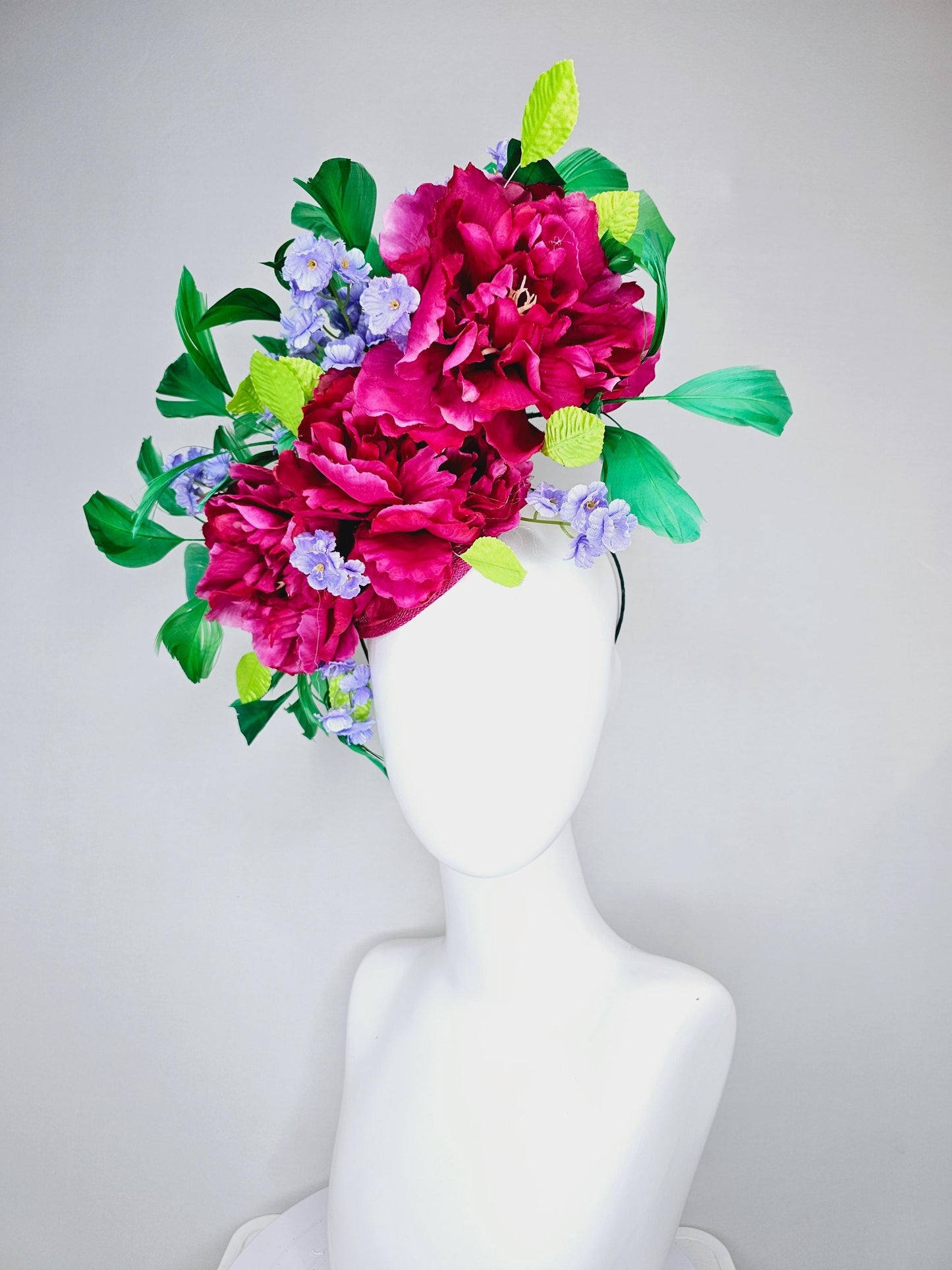 kentucky derby hat fascinator pink sinamay with pink fuchsia satin silk flowers, small light purple flowers,lime green leaves,green feathers