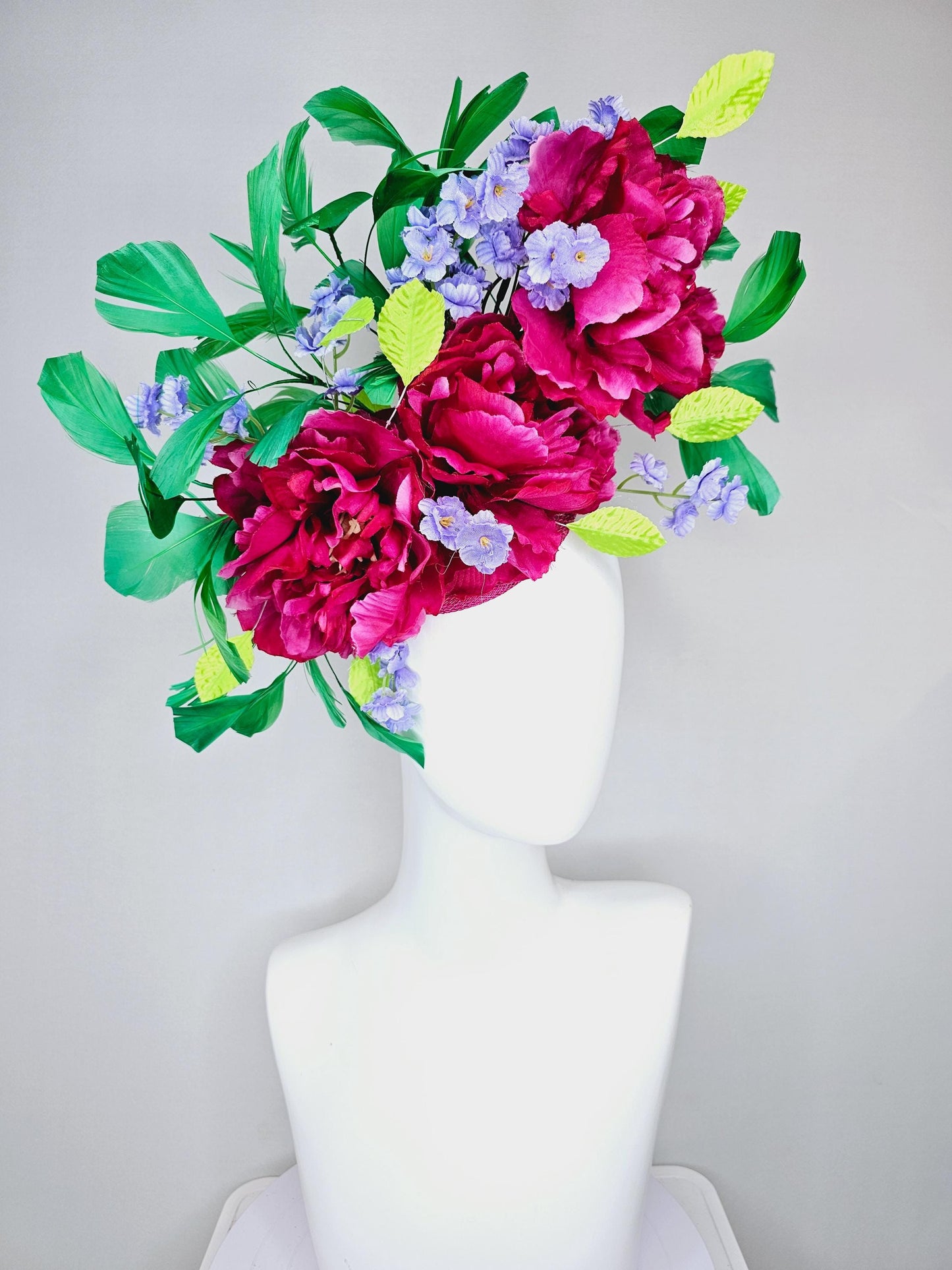 kentucky derby hat fascinator pink sinamay with pink fuchsia satin silk flowers, small light purple flowers,lime green leaves,green feathers