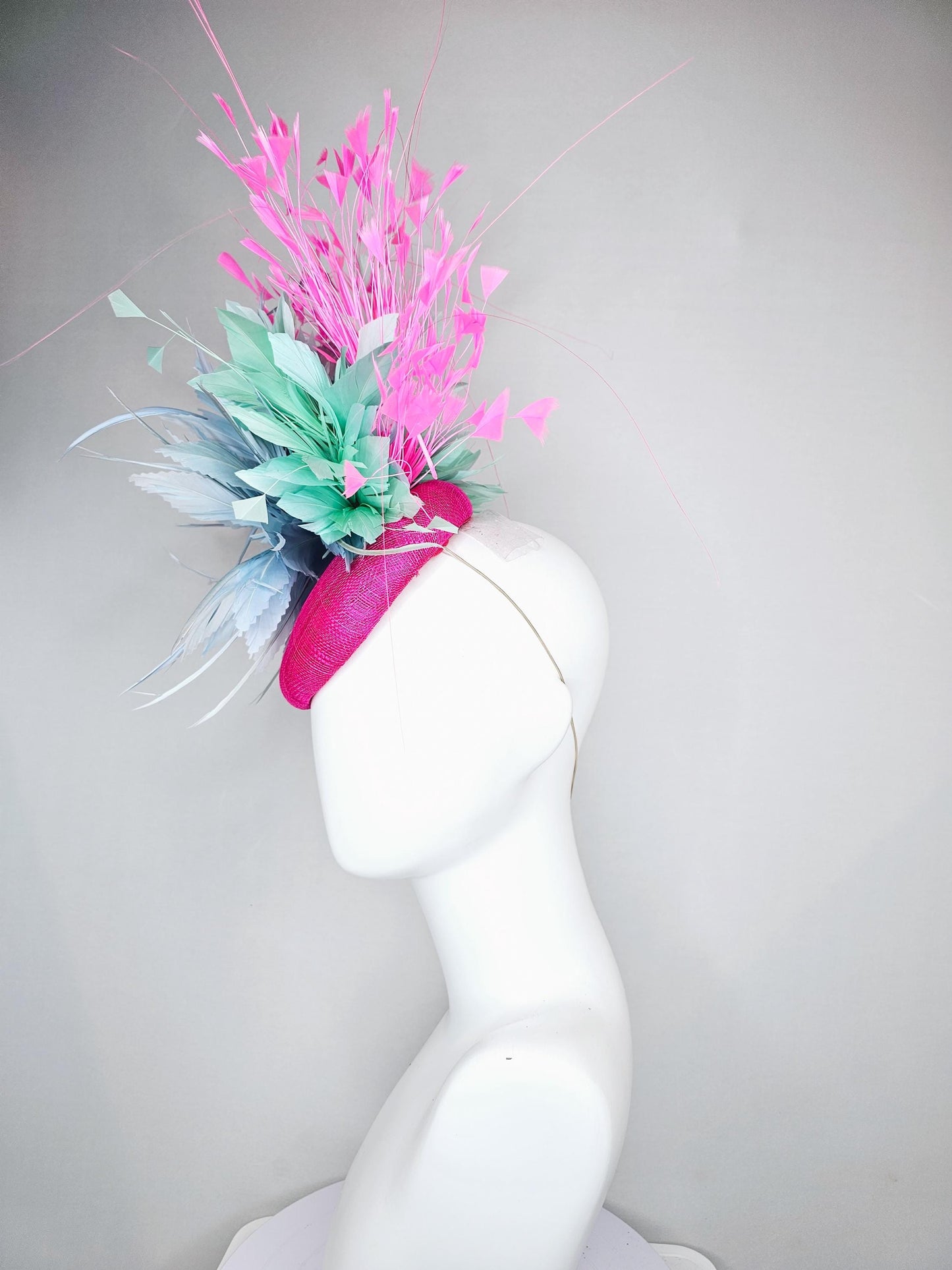 kentucky derby hat fascinator fuchsia pink sinamay with large fluffy light blue aqua blue feather flowers and blush pink branching feathers