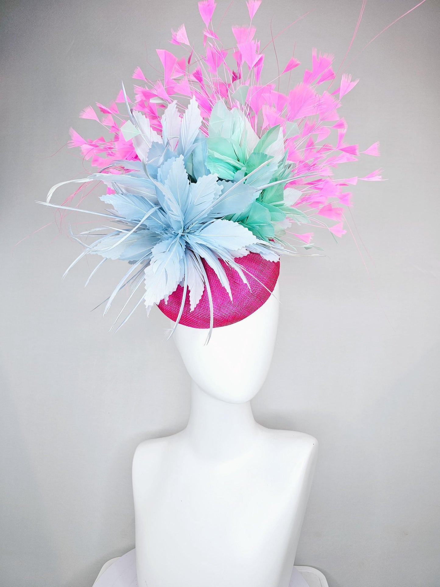 kentucky derby hat fascinator fuchsia pink sinamay with large fluffy light blue aqua blue feather flowers and blush pink branching feathers