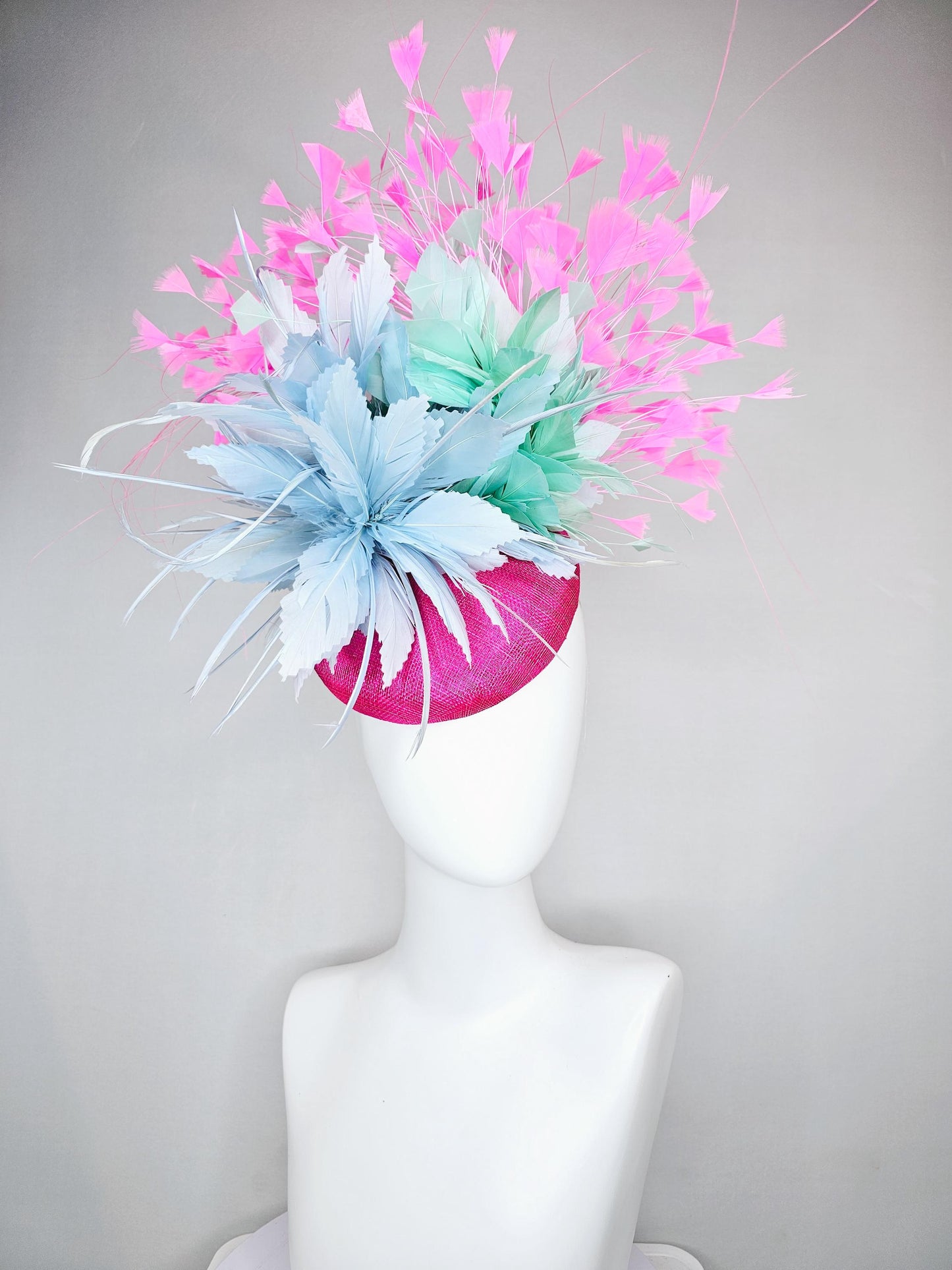 kentucky derby hat fascinator fuchsia pink sinamay with large fluffy light blue aqua blue feather flowers and blush pink branching feathers