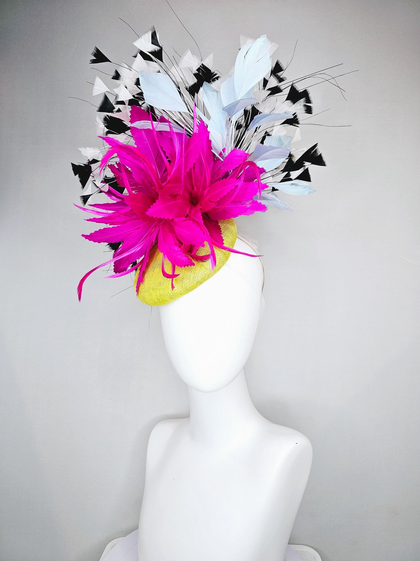 kentucky derby hat fascinator yellow sinamay with large fluffy fuchsia pink light blue feather flowers, black and white branching feathers