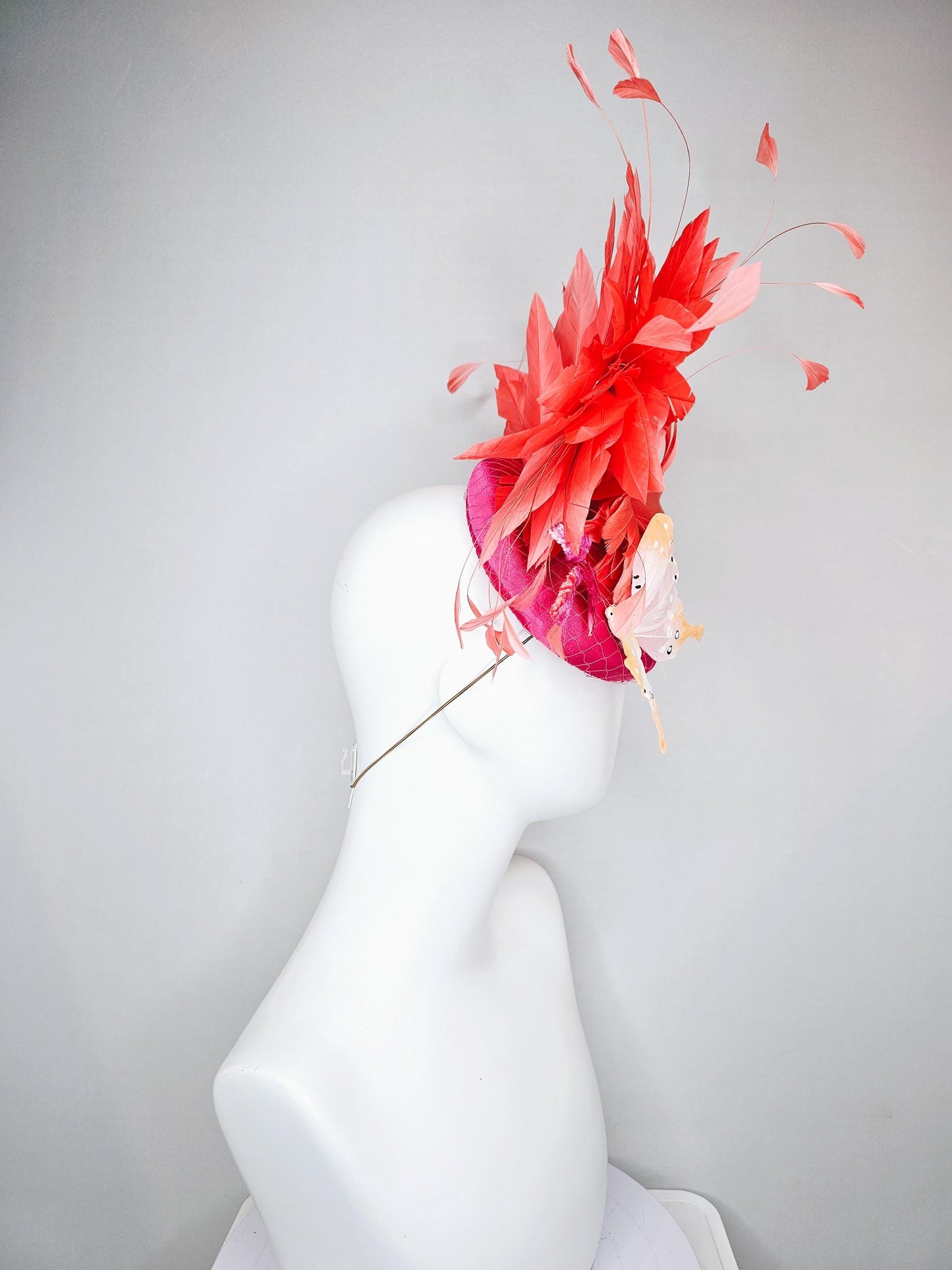 kentucky derby hat fascinator pink satin with netting,orange coral feather flower,pink leaves,orange branching feathers,white butterflies