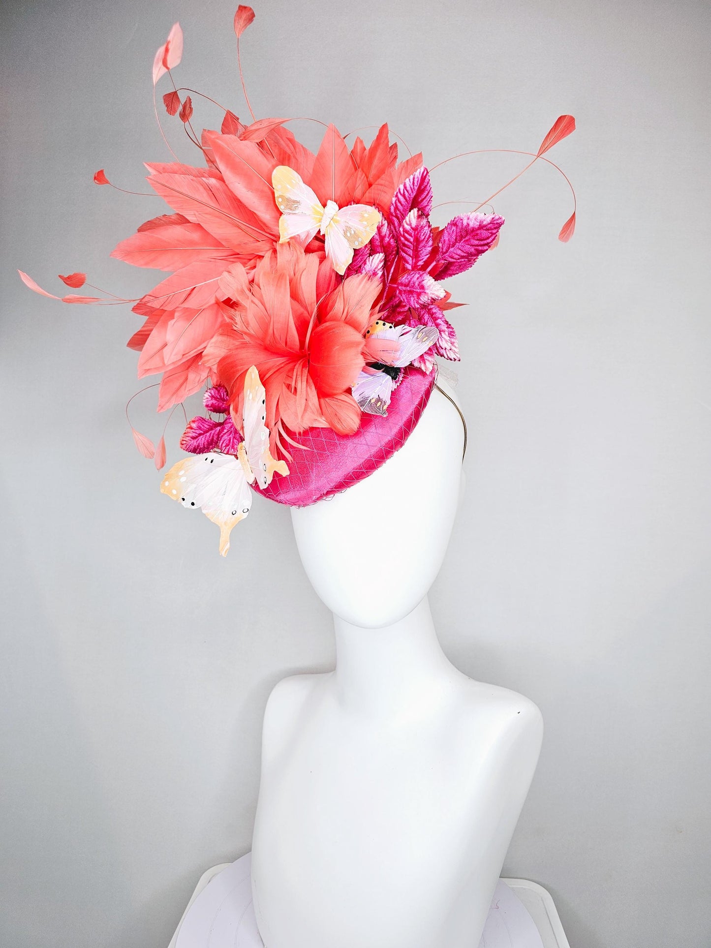 kentucky derby hat fascinator pink satin with netting,orange coral feather flower,pink leaves,orange branching feathers,white butterflies