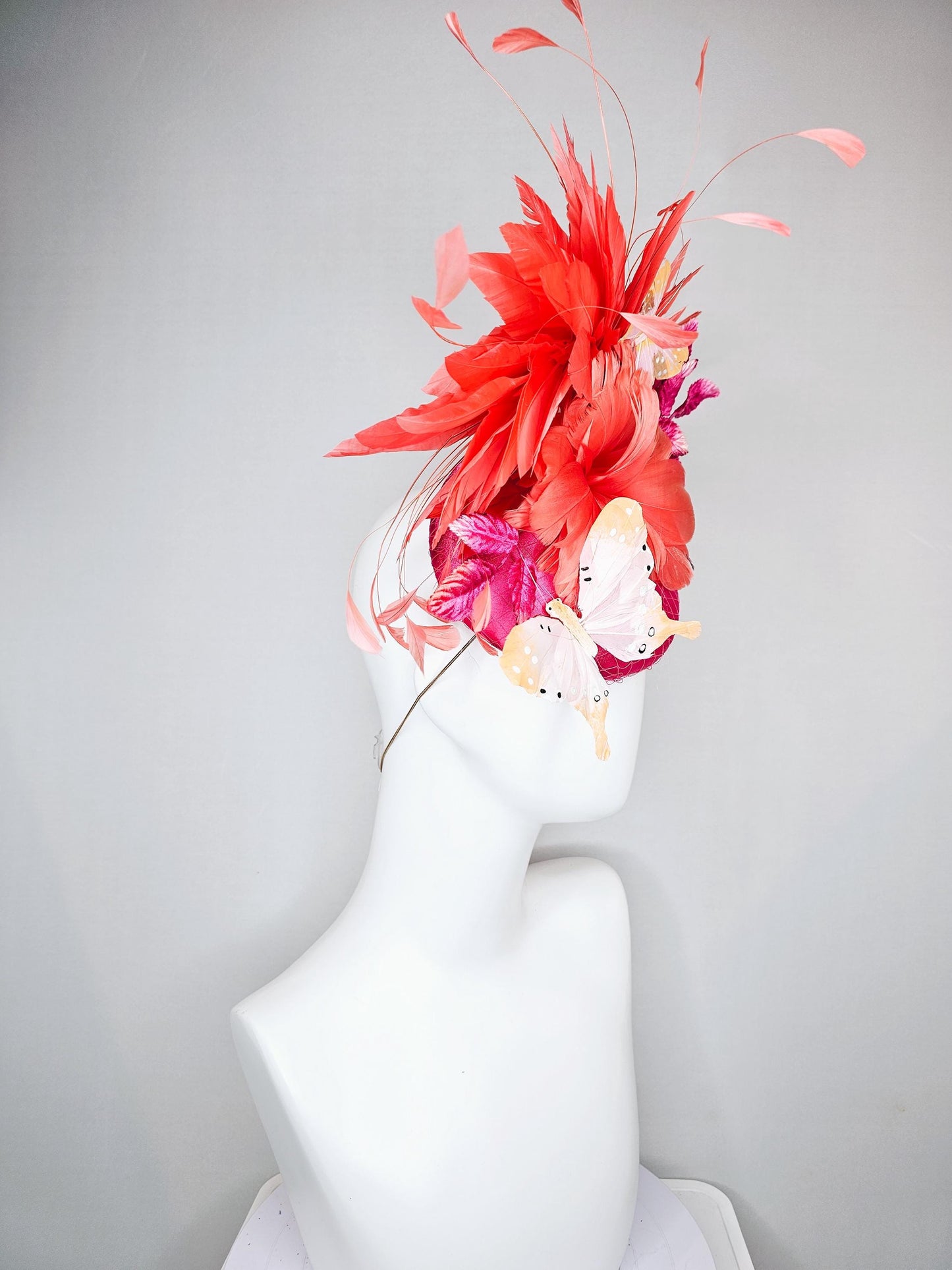 kentucky derby hat fascinator pink satin with netting,orange coral feather flower,pink leaves,orange branching feathers,white butterflies