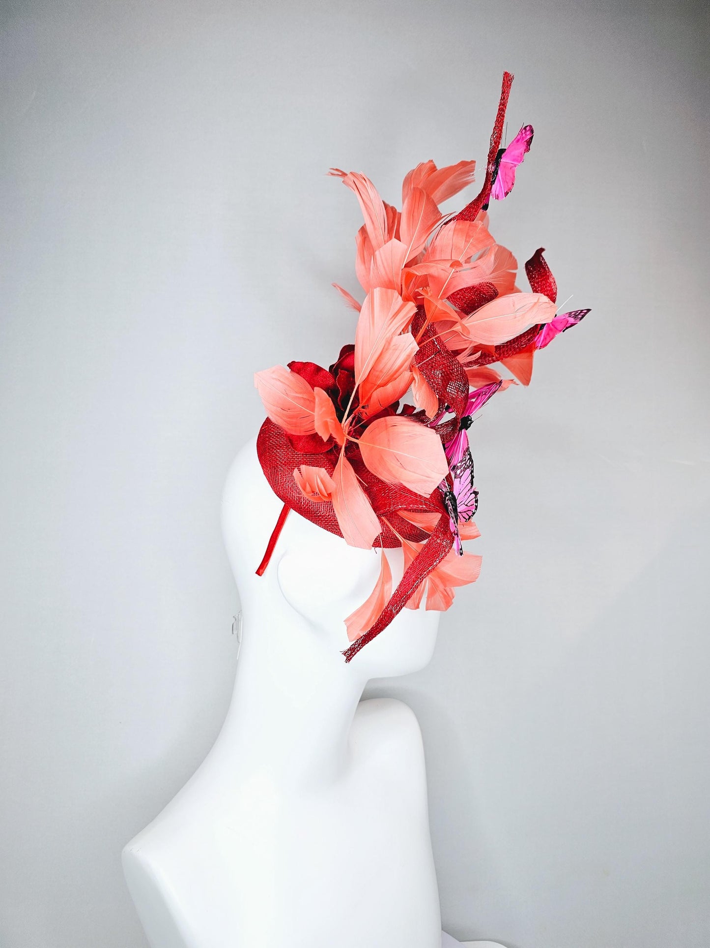 kentucky derby hat fascinator orange coral sinamay with curls, orange coral peach feathers, pink and black butterflies