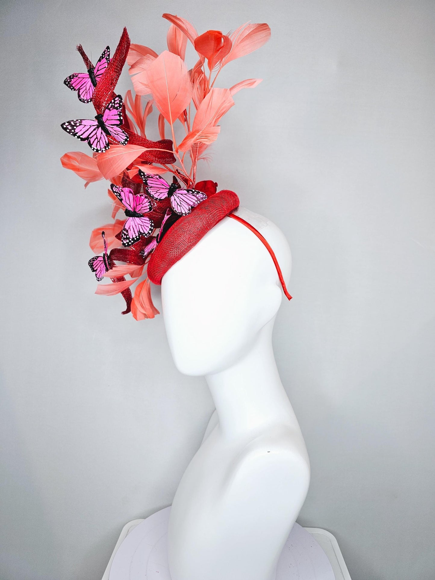 kentucky derby hat fascinator orange coral sinamay with curls, orange coral peach feathers, pink and black butterflies