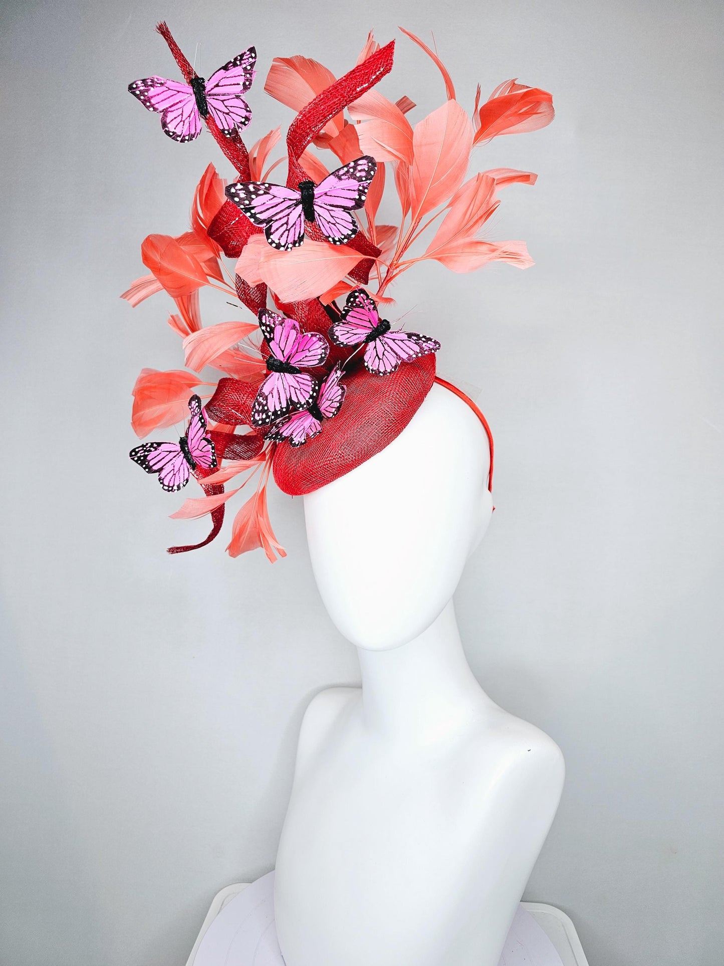 kentucky derby hat fascinator orange coral sinamay with curls, orange coral peach feathers, pink and black butterflies