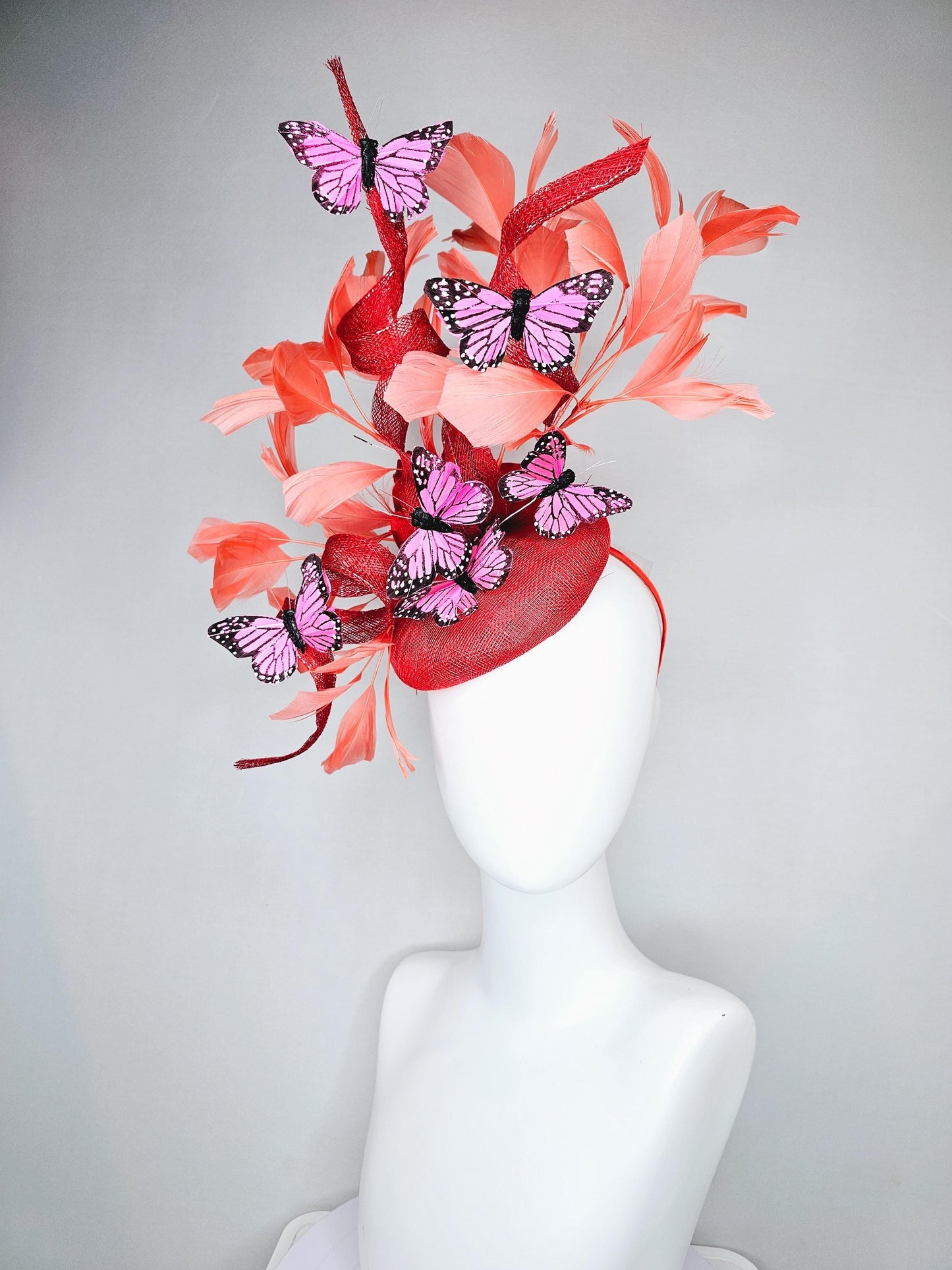 kentucky derby hat fascinator orange coral sinamay with curls, orange coral peach feathers, pink and black butterflies