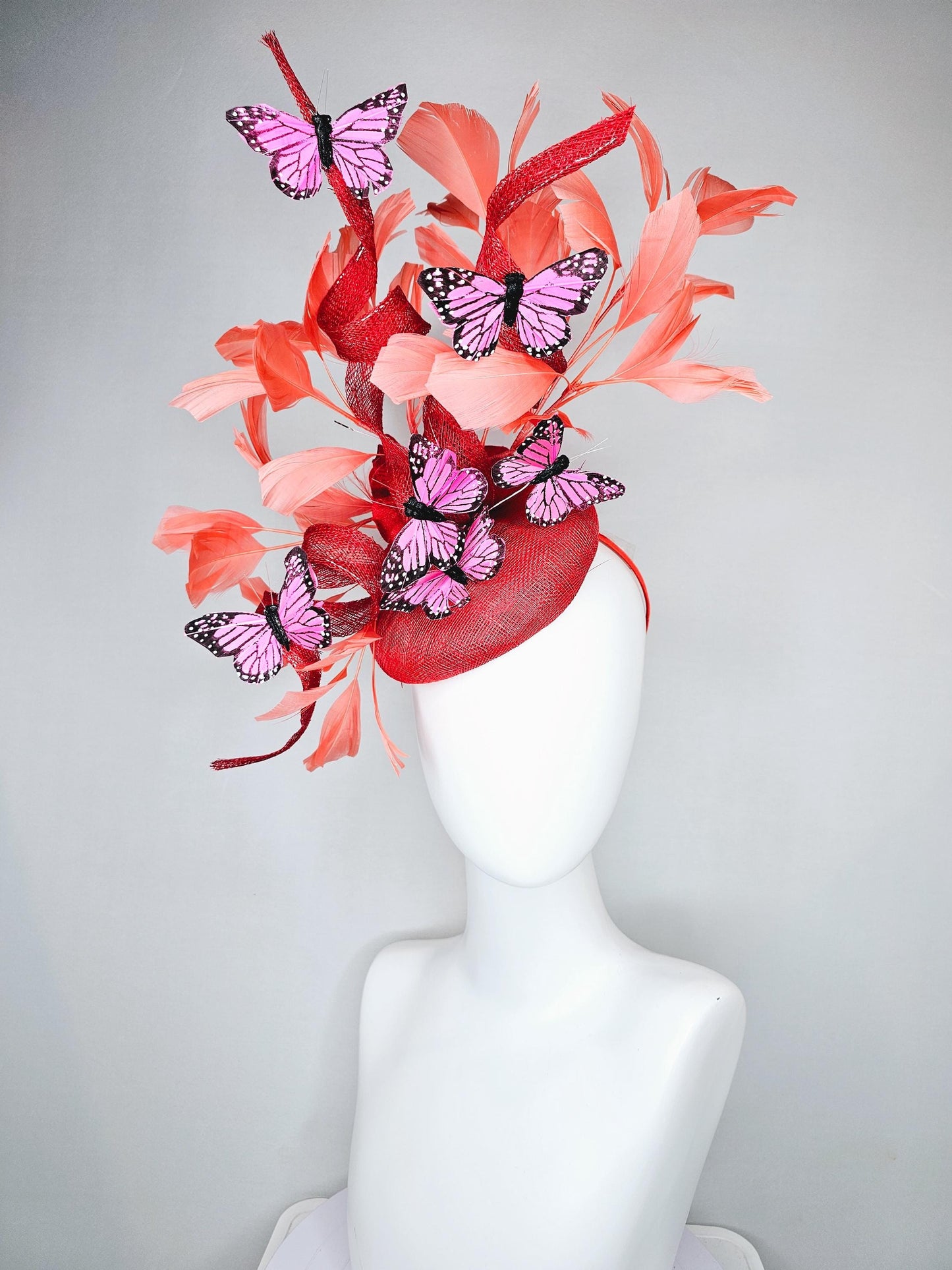 kentucky derby hat fascinator orange coral sinamay with curls, orange coral peach feathers, pink and black butterflies