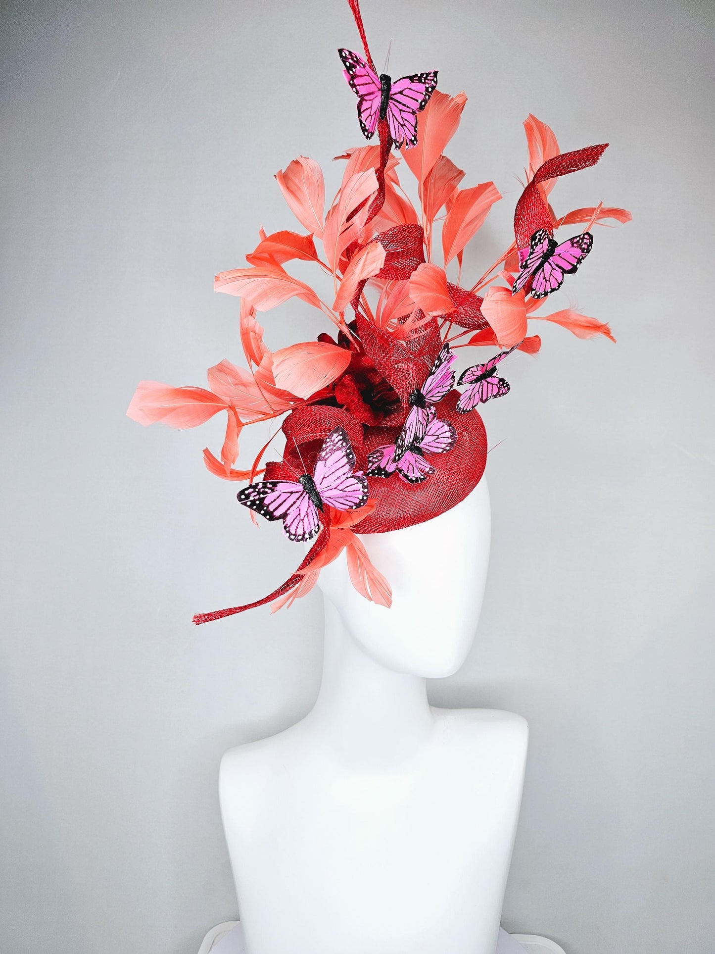 kentucky derby hat fascinator orange coral sinamay with curls, orange coral peach feathers, pink and black butterflies