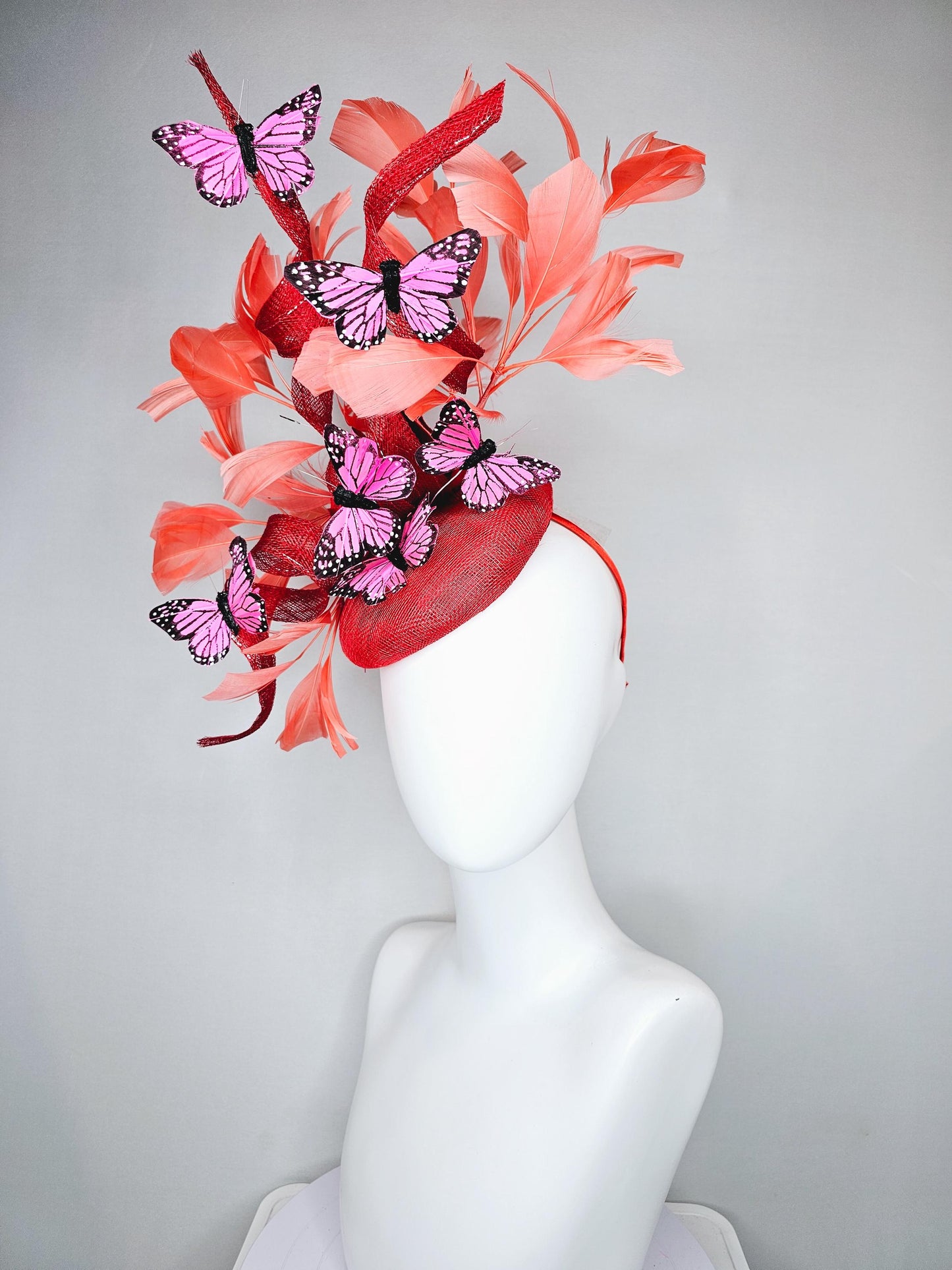 kentucky derby hat fascinator orange coral sinamay with curls, orange coral peach feathers, pink and black butterflies