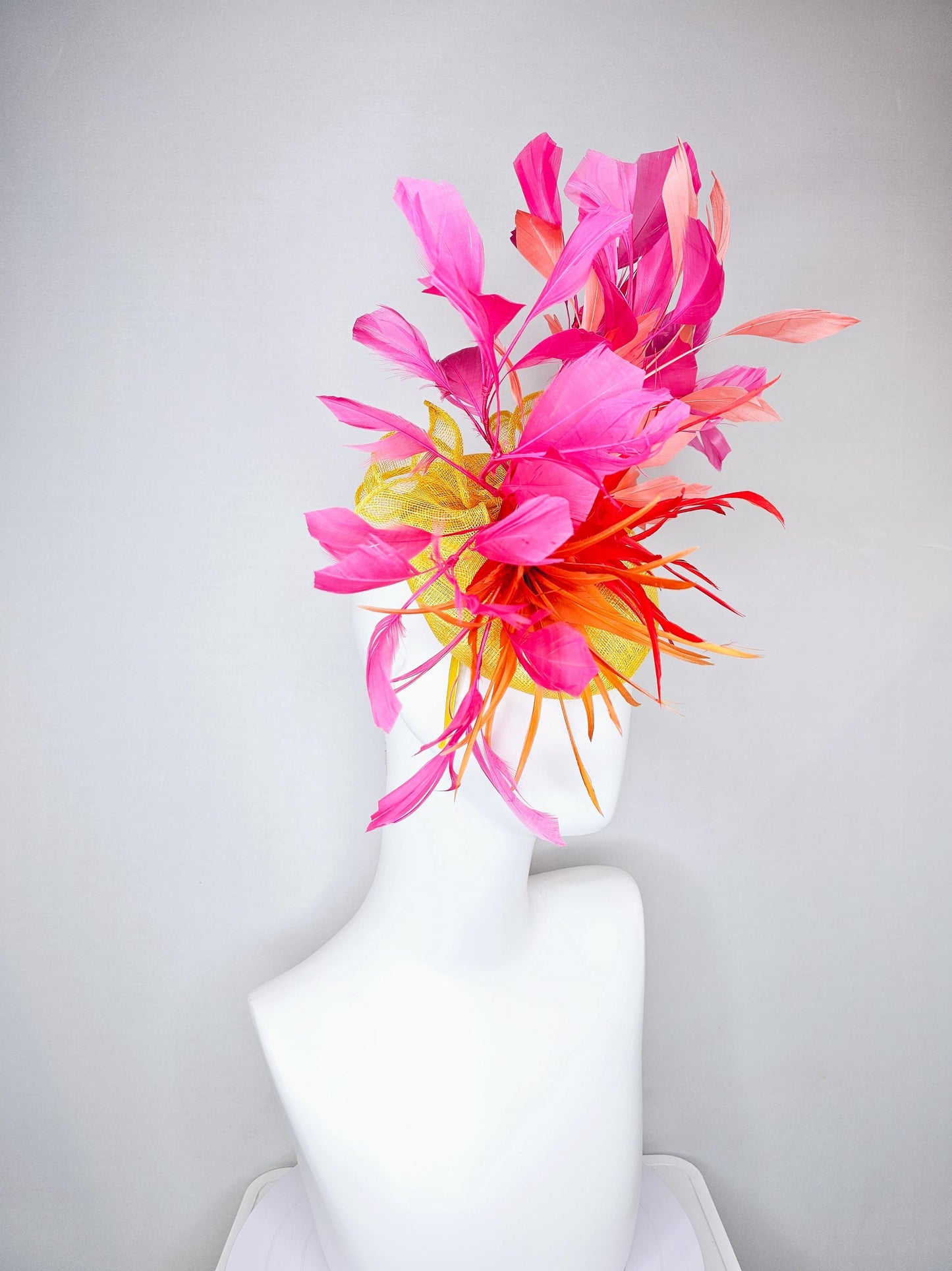 kentucky derby hat fascinator yellow sinamay and curls with bright red feather flower with branching orange, coral, peach and pink feathers