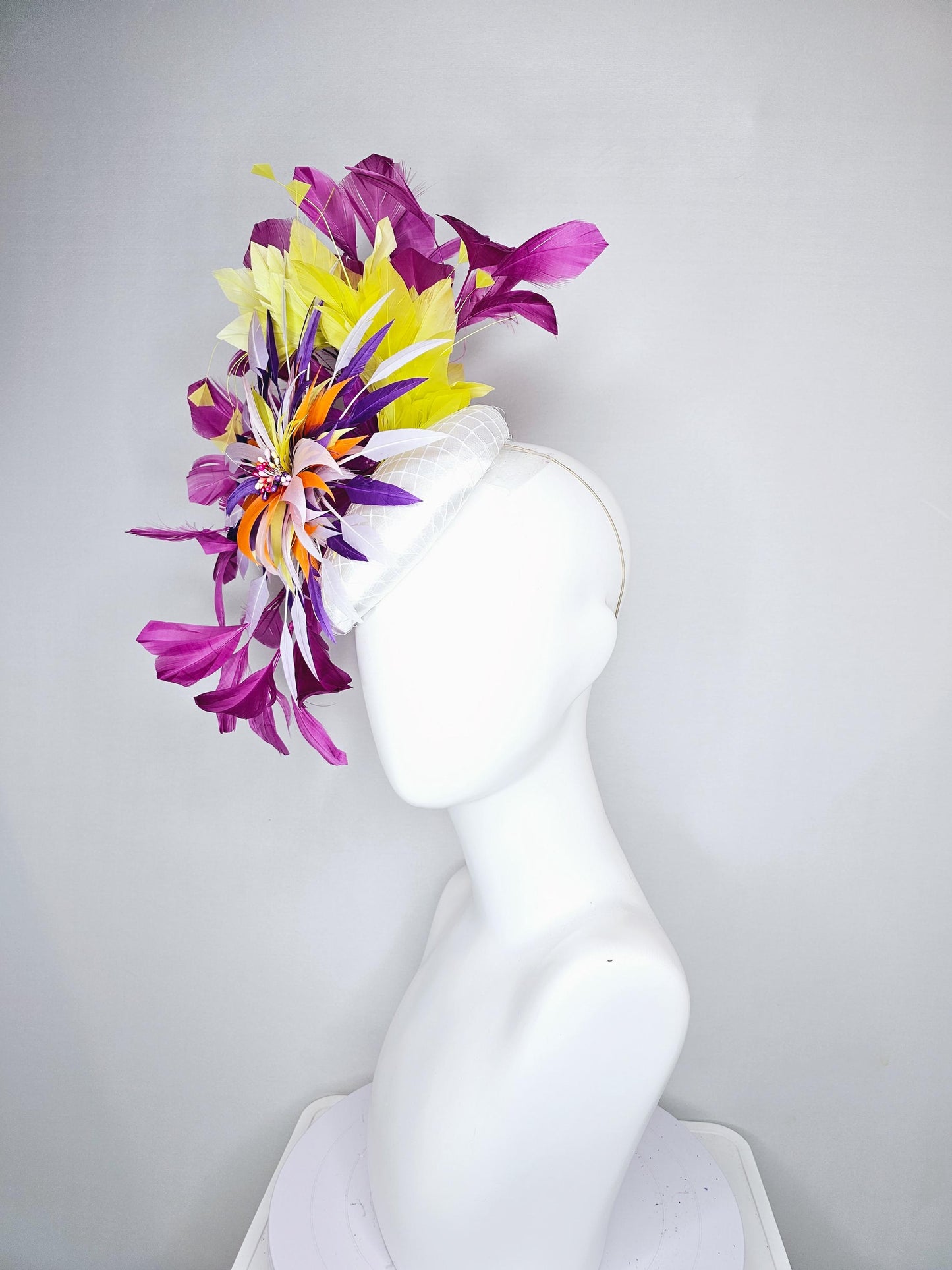 kentucky derby hat fascinator white satin with netting, orange yellow white purple feather flower, yellow purple magenta branching feathers