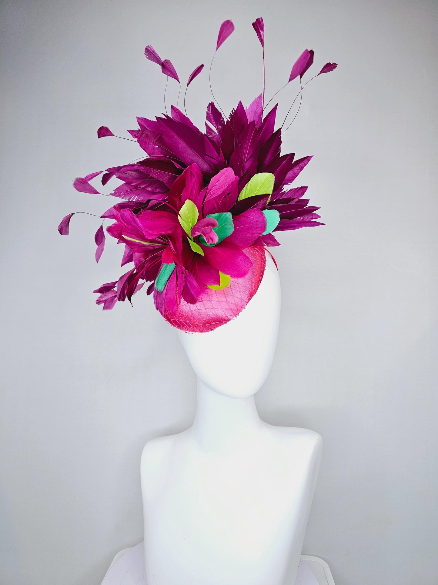 kentucky derby hat fascinator hot pink satin with netting magenta purple branching feathers and lime green blue green aqua pink feathers