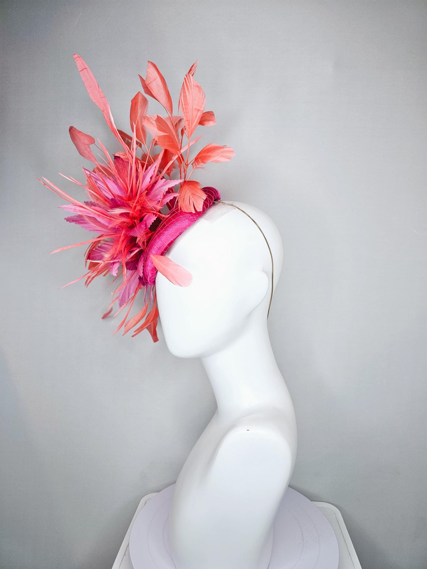 kentucky derby hat fascinator hot pink satin with netting,and light pink feather flowers with coral orange peach branching feathers