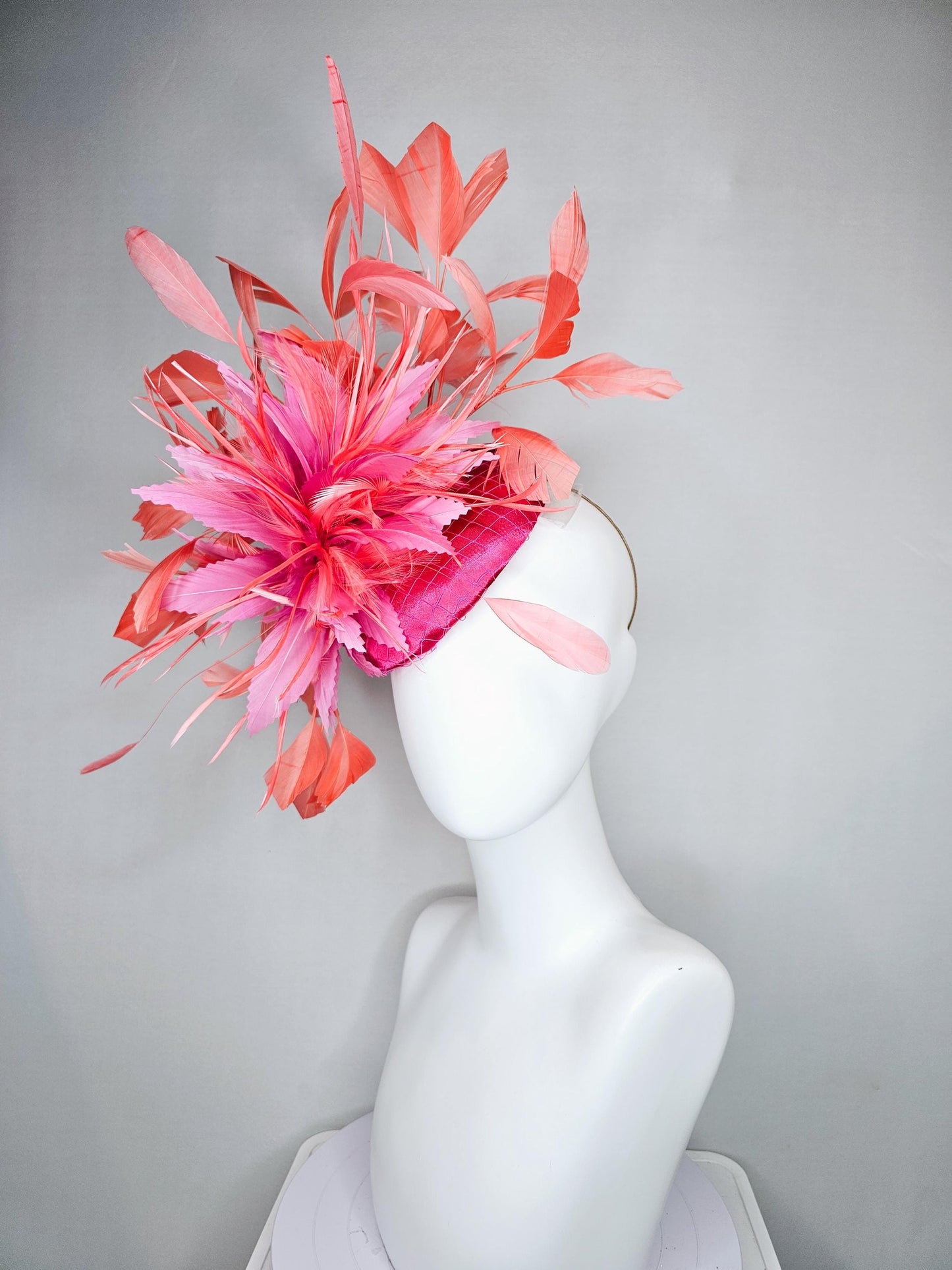 kentucky derby hat fascinator hot pink satin with netting,and light pink feather flowers with coral orange peach branching feathers