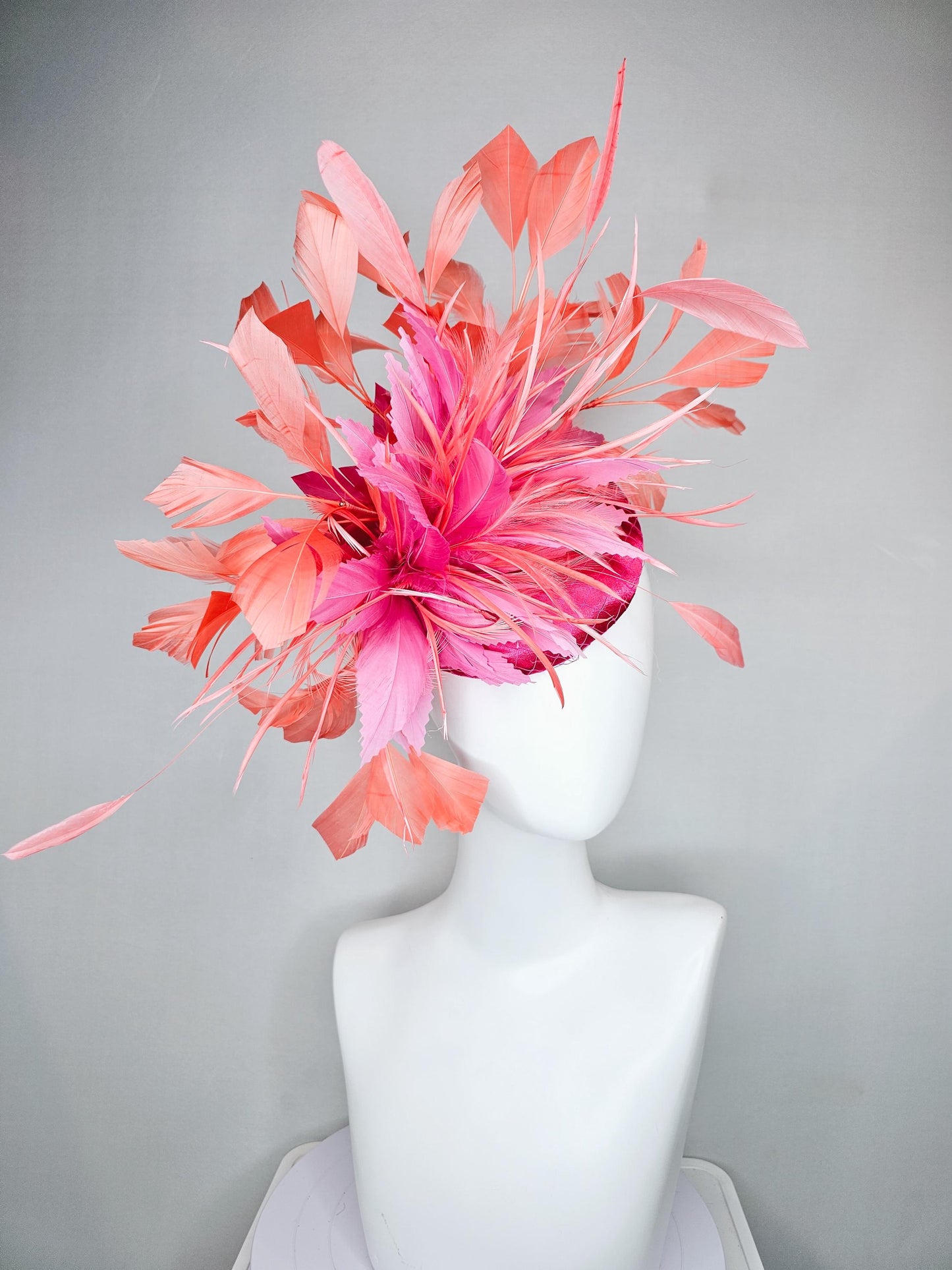 kentucky derby hat fascinator hot pink satin with netting,and light pink feather flowers with coral orange peach branching feathers
