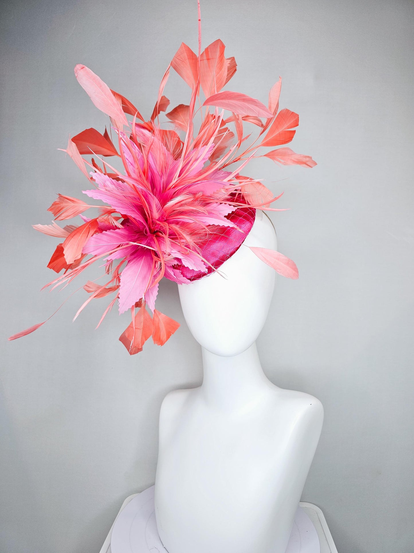 kentucky derby hat fascinator hot pink satin with netting,and light pink feather flowers with coral orange peach branching feathers