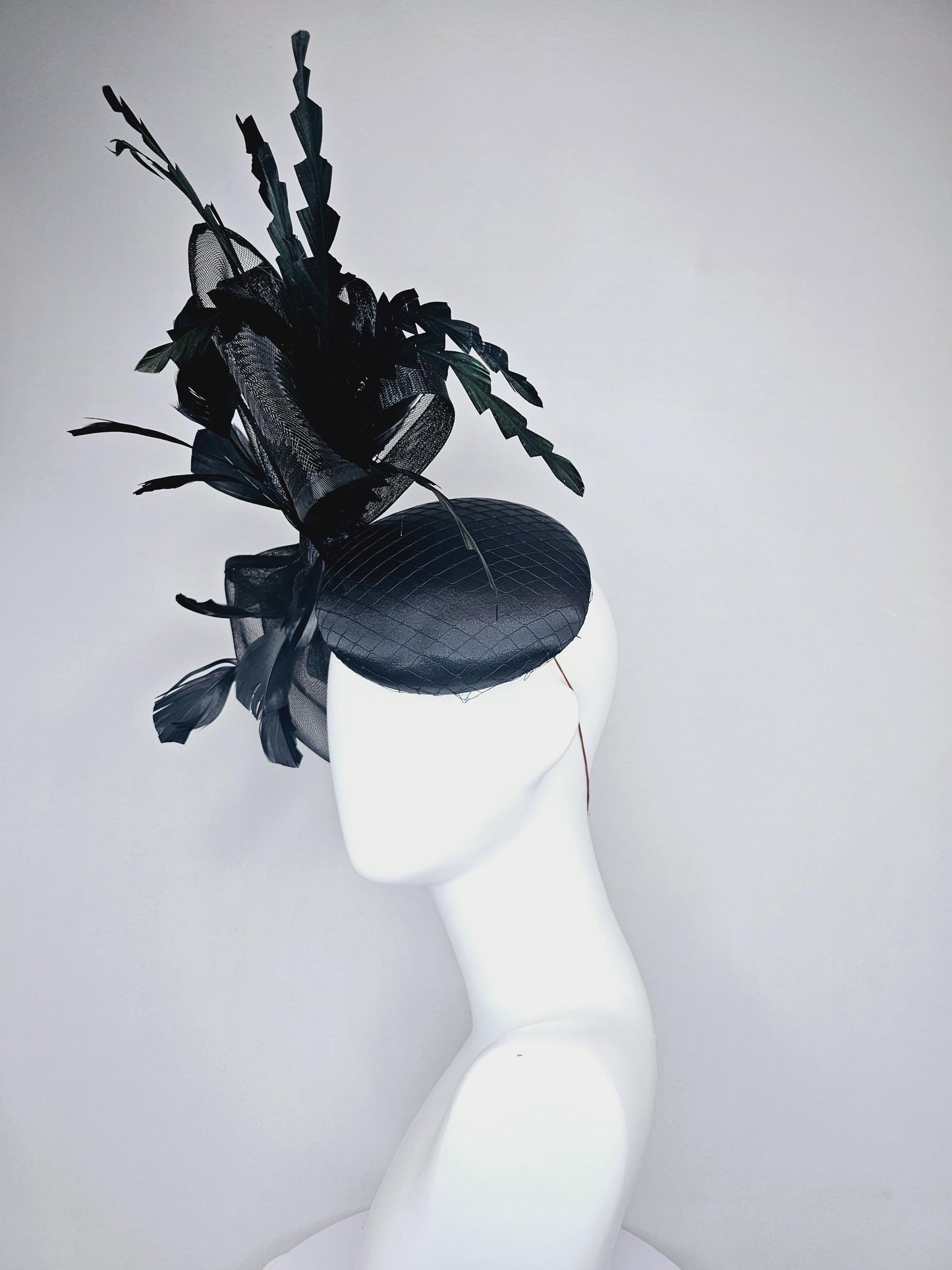 kentucky derby hat fascinator black satin with netting with large black mesh bow and black zigzag branching feathers