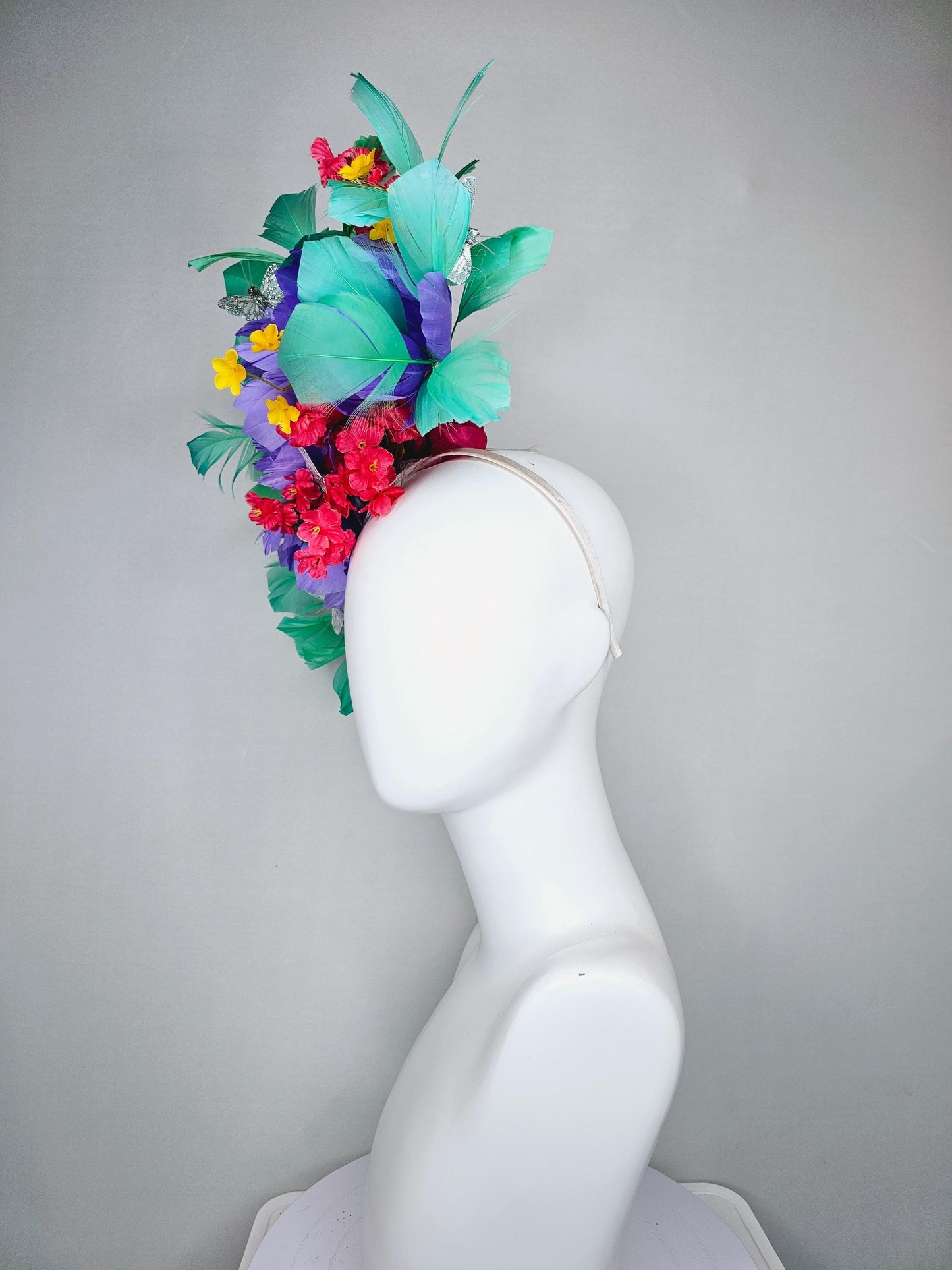 kentucky derby hat fascinator headband rainbow colorful yellow red flowers large purple feather flowers green feathers glitter butterflies