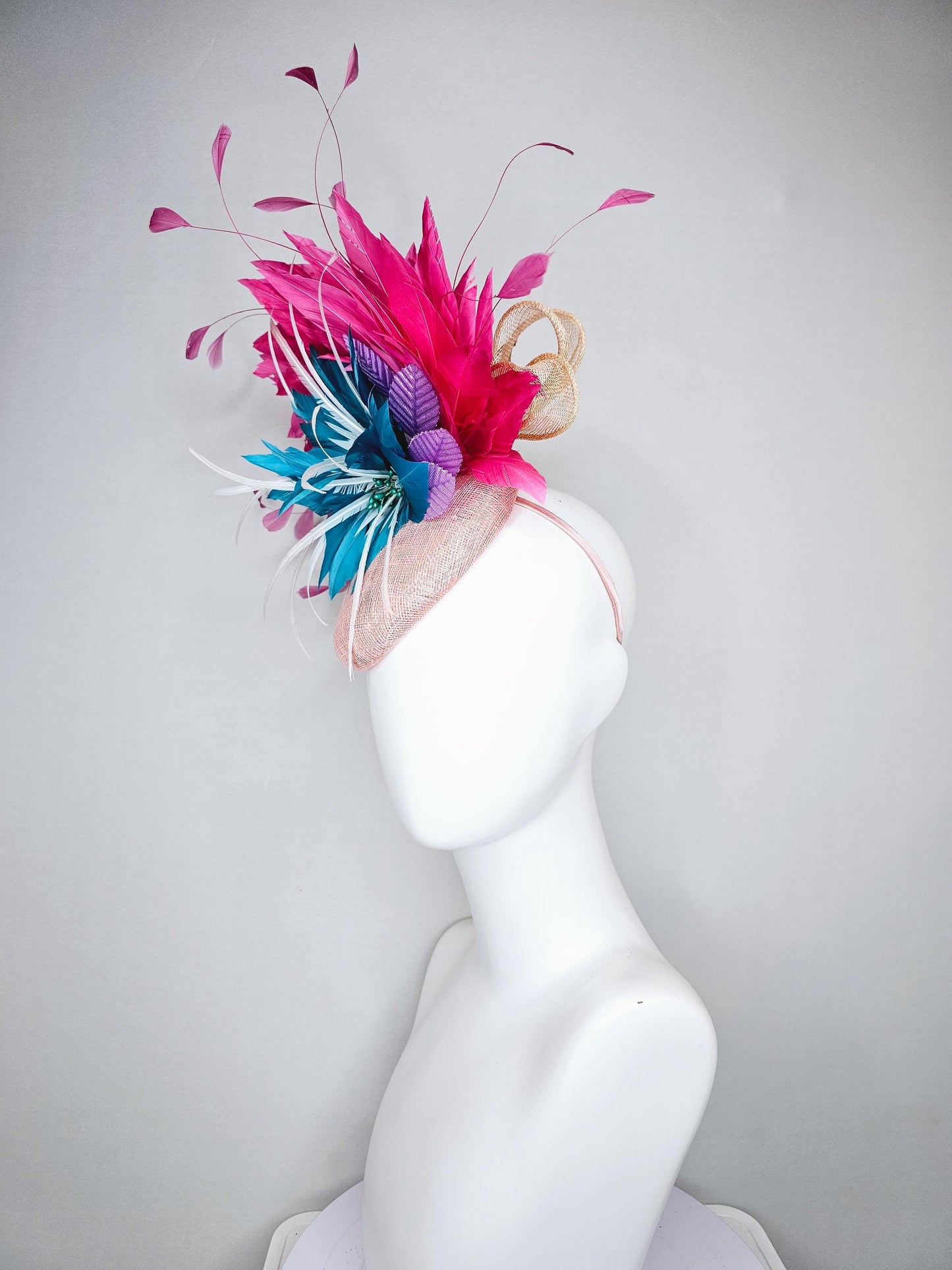kentucky derby hat fascinator light pink sinamay with royal blue feather flower with fuchsia hot pink feathers and purple velvet leaves