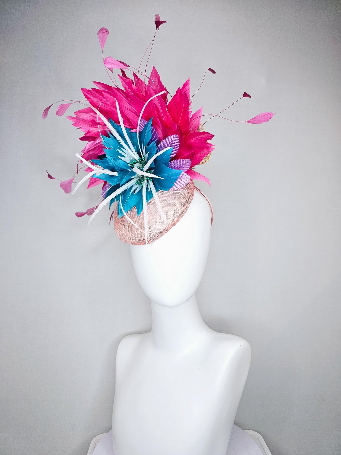 kentucky derby hat fascinator light pink sinamay with royal blue feather flower with fuchsia hot pink feathers and purple velvet leaves