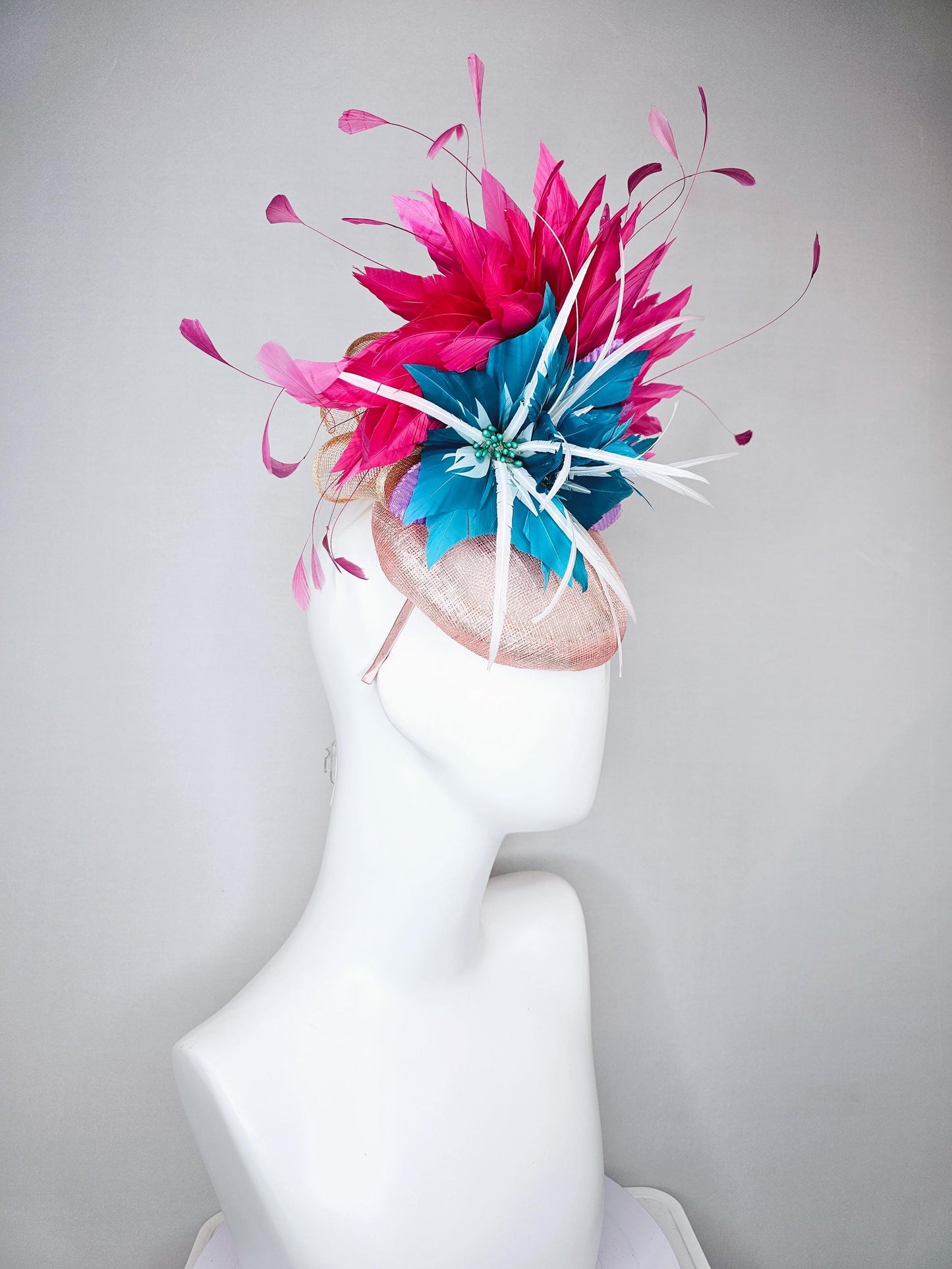 kentucky derby hat fascinator light pink sinamay with royal blue feather flower with fuchsia hot pink feathers and purple velvet leaves