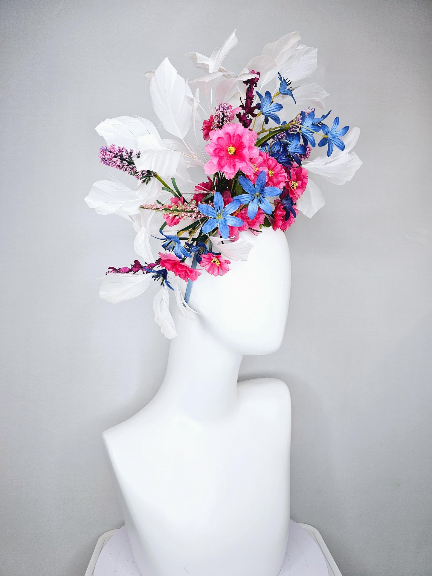 kentucky derby hat fascinator headband with pink and blue satin flowers and branching lavender purple stems with white feathers