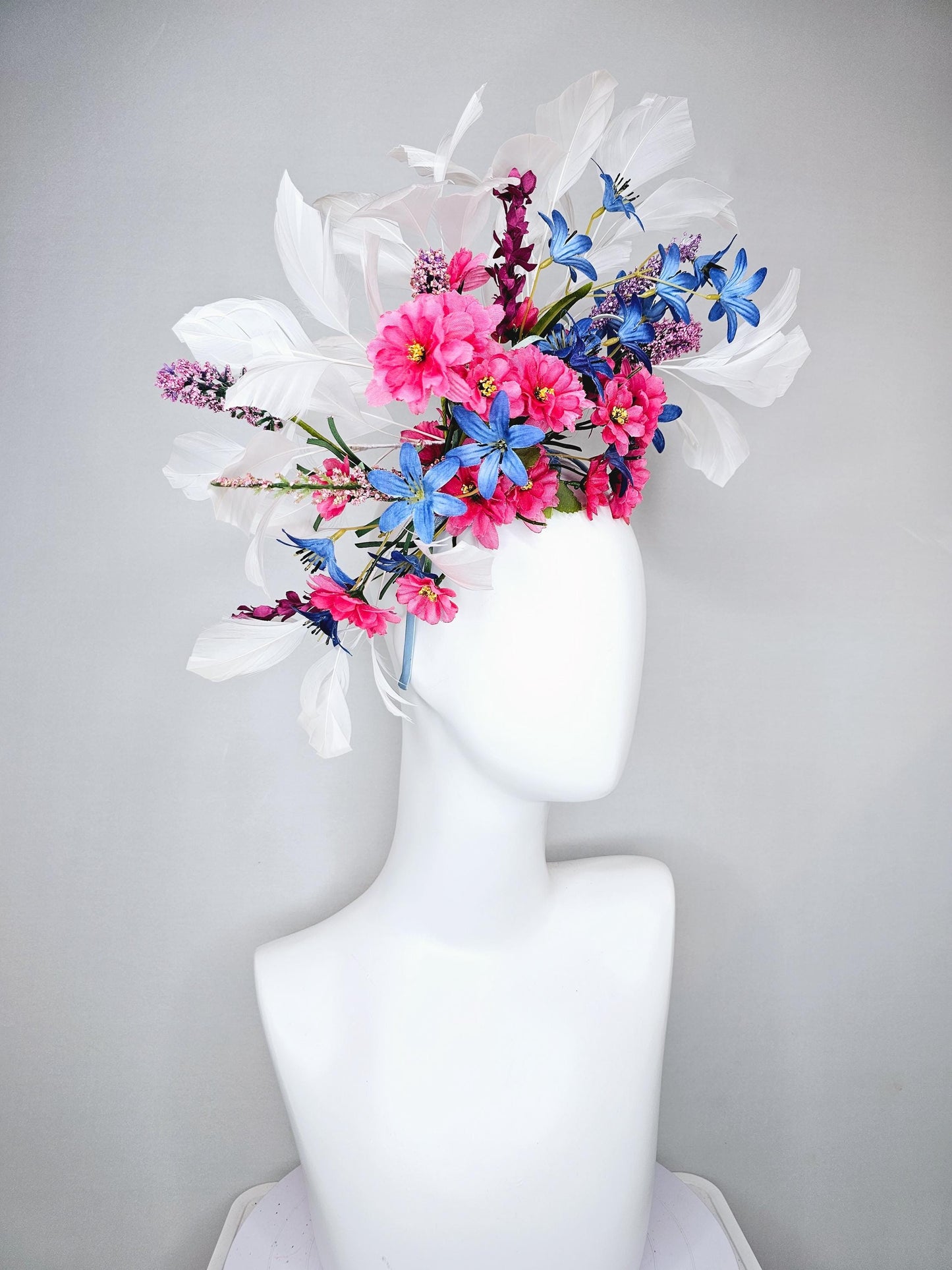 kentucky derby hat fascinator headband with pink and blue satin flowers and branching lavender purple stems with white feathers