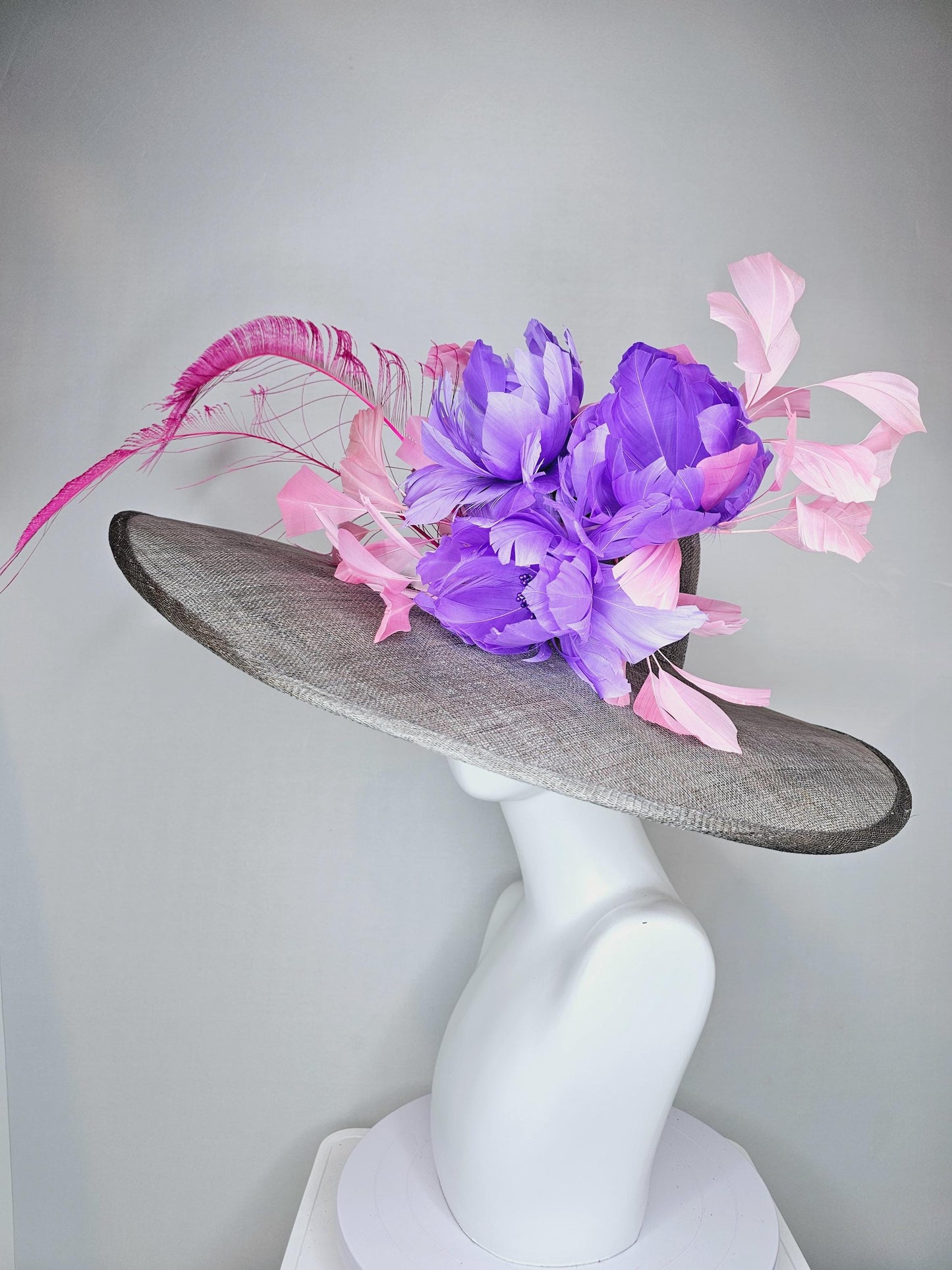kentucky derby gray sinamay large wide brim hat with purple feather flowers and branching light pink feathers with hot pink long feathers