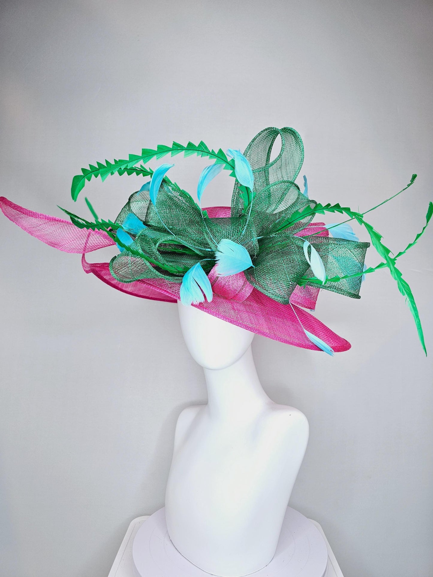 kentucky derby hat large wide brim sinamay hot pink hat with emerald green sinamay bow, green and sky light blue branching feathers